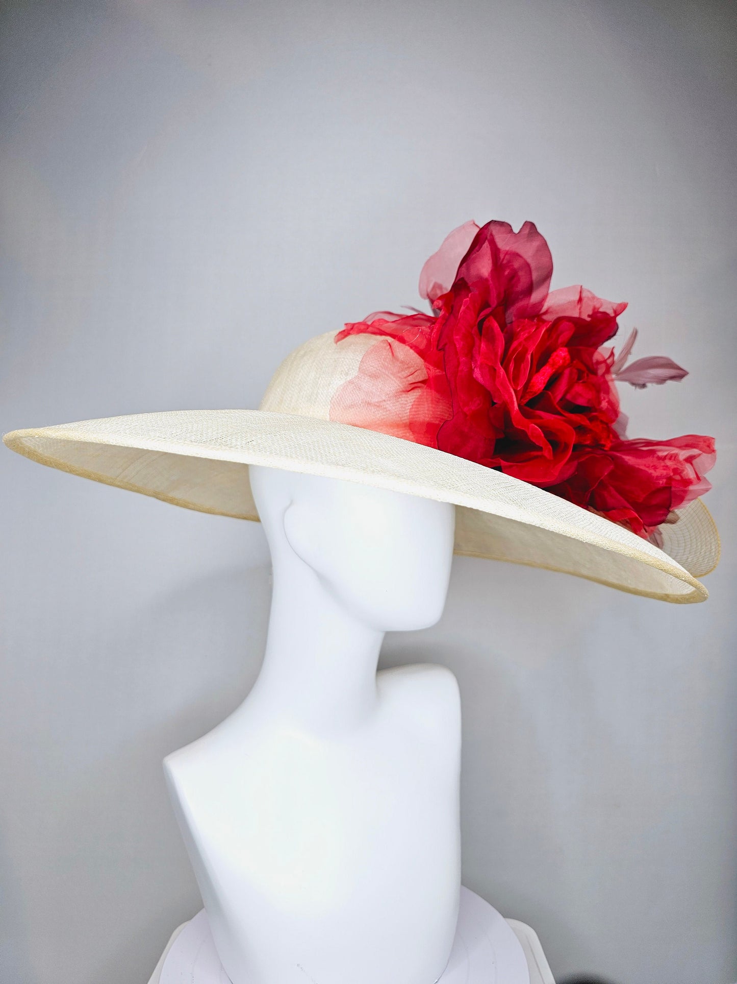 kentucky derby hat large wide brim sinamay neutral taupe beige hat with large red organza flower and blush pink feathers with gold crinoline