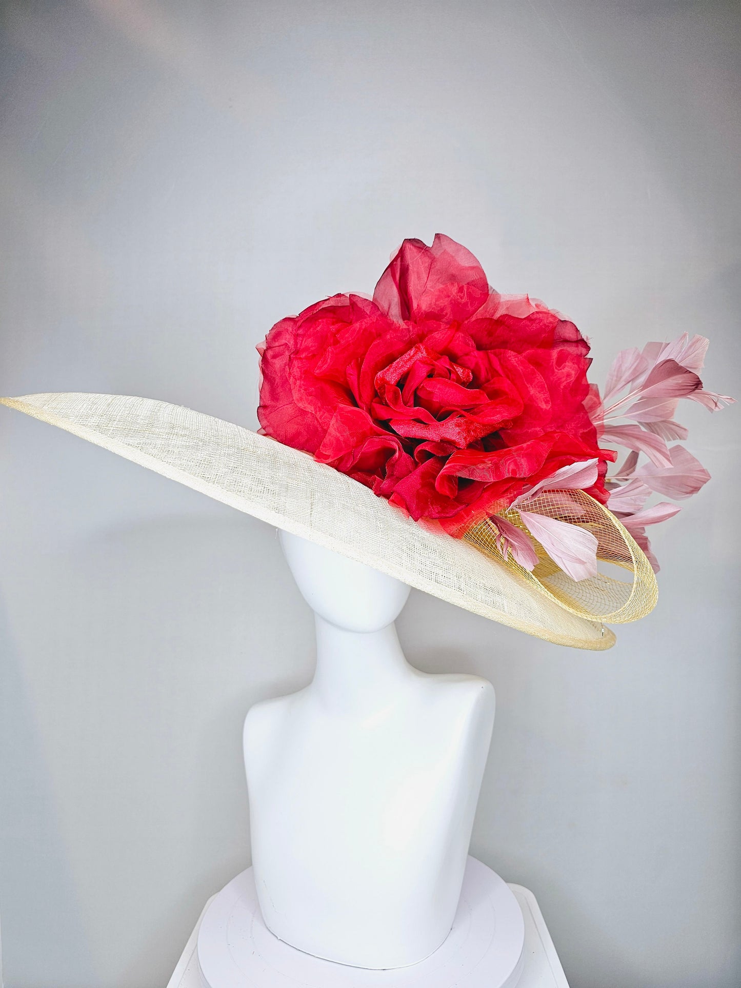 kentucky derby hat large wide brim sinamay neutral taupe beige hat with large red organza flower and blush pink feathers with gold crinoline