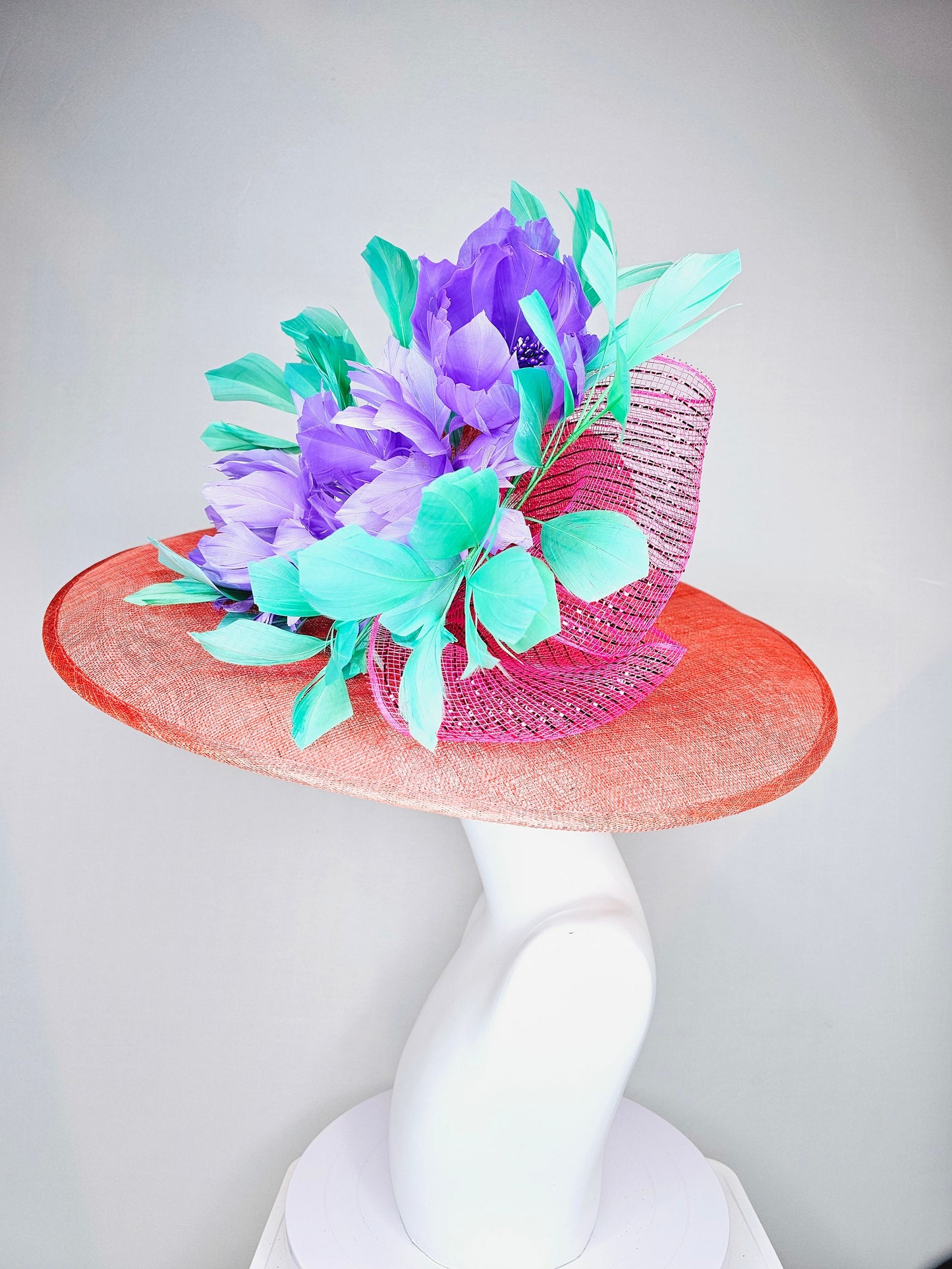 kentucky derby hat large wide brim sinamay orange coral hat with green feathers and purple fluffy feather flowers w pink crinoline