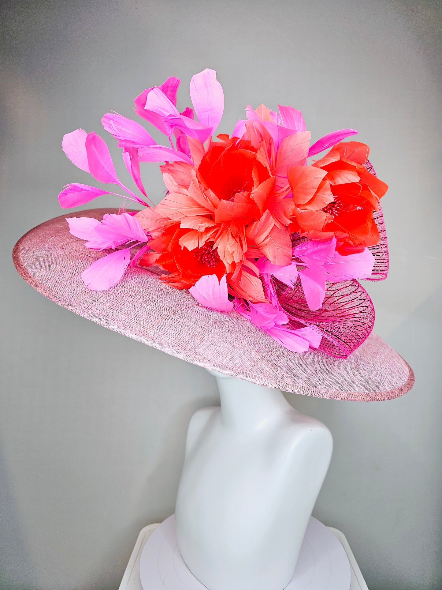 kentucky derby hat large wide brim sinamay light pink hat with large orange coral feather flowers and fuchsia pink feathers w pink crinoline