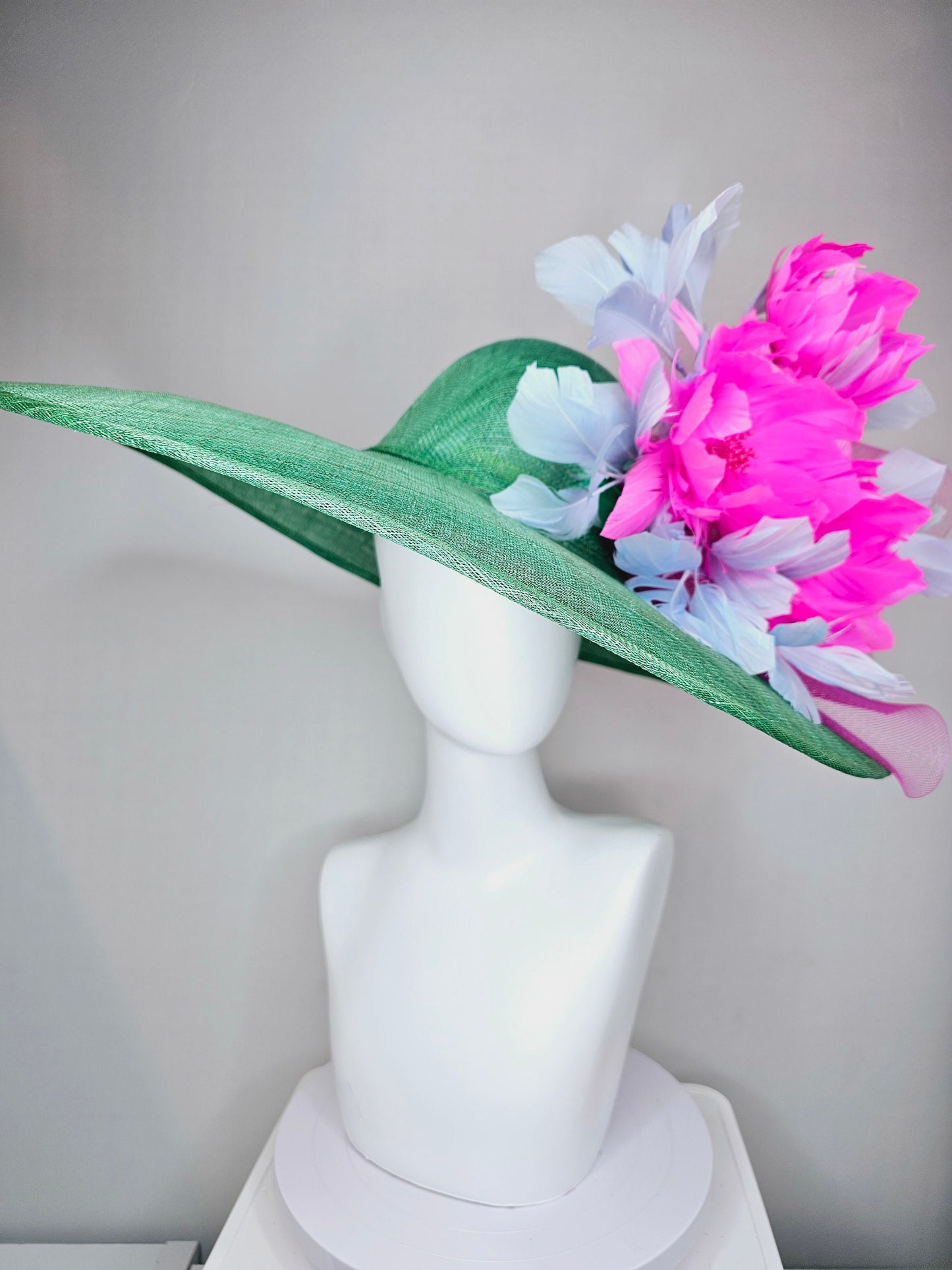 kentucky derby hat large wide brim sinamay emerald green hat with fuchsia pink feather flower and lavender feathers with pink crinoline