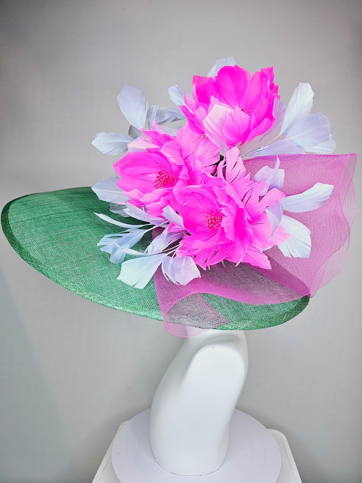 kentucky derby hat large wide brim sinamay emerald green hat with fuchsia pink feather flower and lavender feathers with pink crinoline