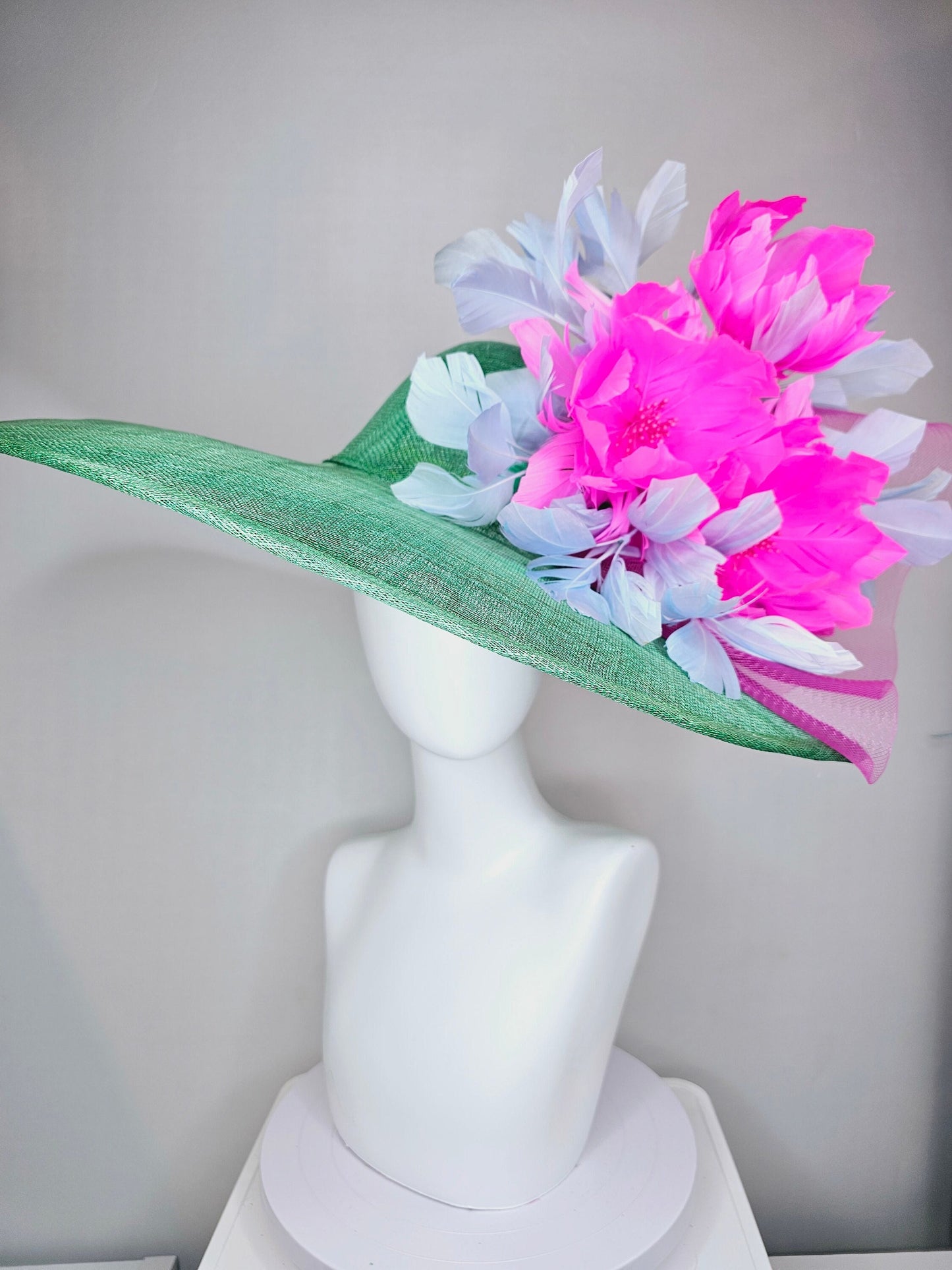 kentucky derby hat large wide brim sinamay emerald green hat with fuchsia pink feather flower and lavender feathers with pink crinoline