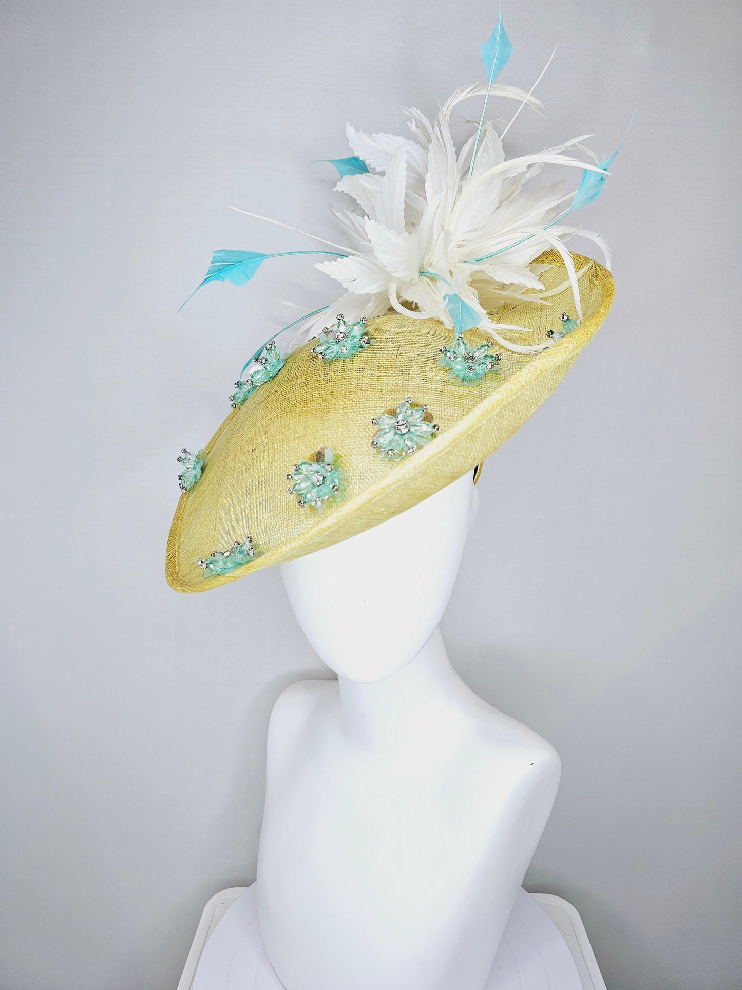 kentucky derby hat fascinator yellow sinamay saucer with white and blue feathers with blue crystal jewel beaded flowers