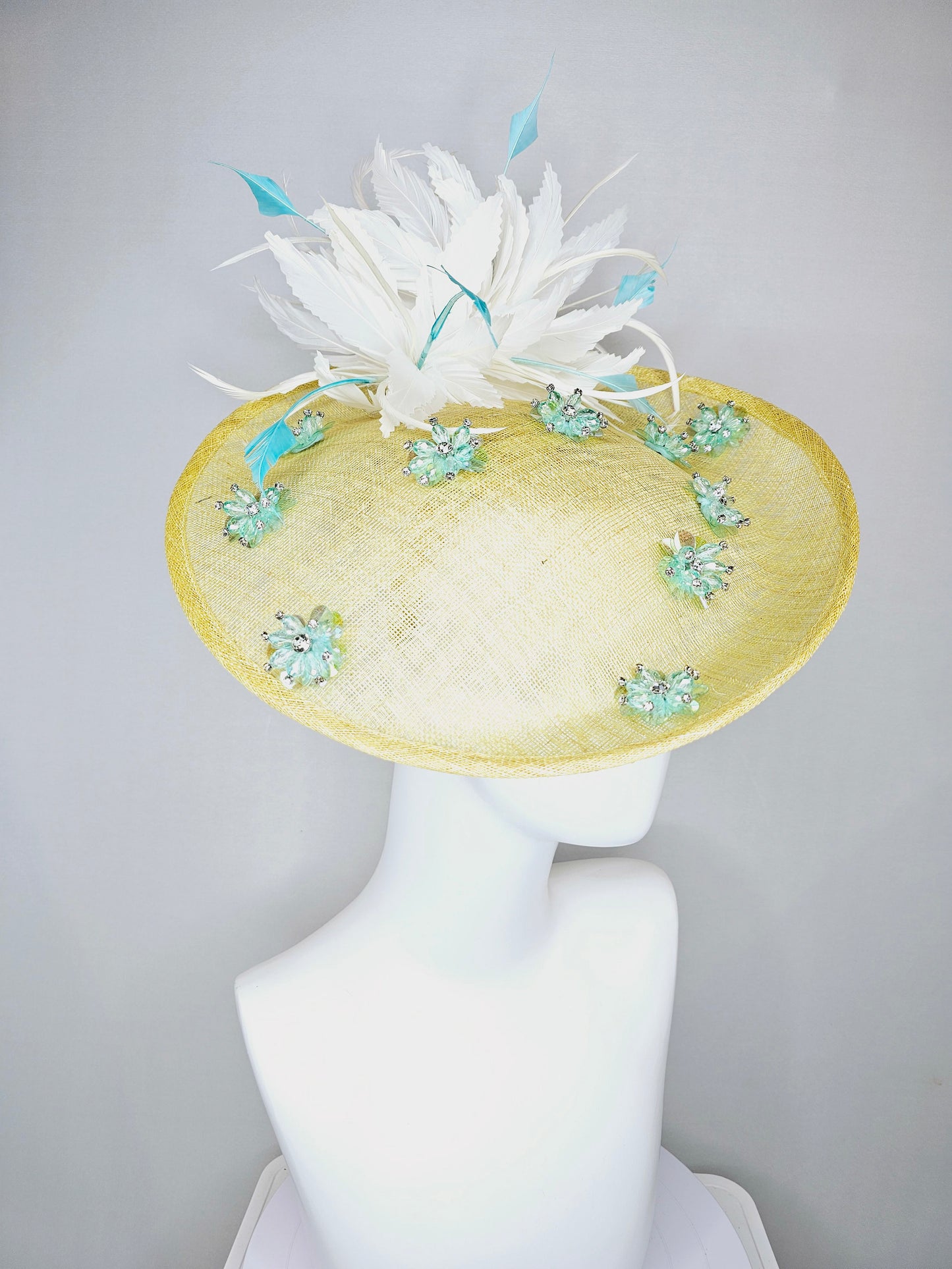 kentucky derby hat fascinator yellow sinamay saucer with white and blue feathers with blue crystal jewel beaded flowers