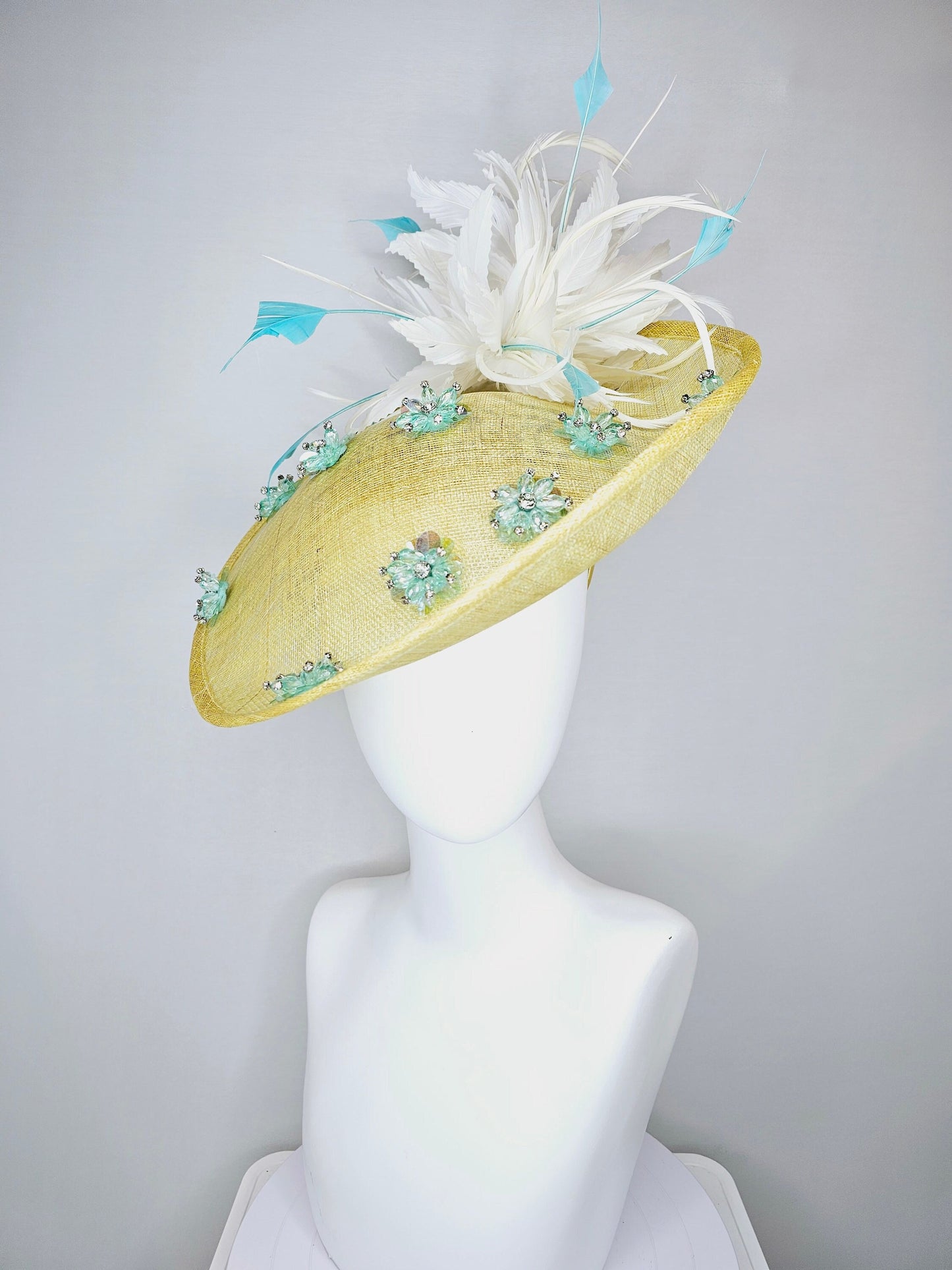 kentucky derby hat fascinator yellow sinamay saucer with white and blue feathers with blue crystal jewel beaded flowers