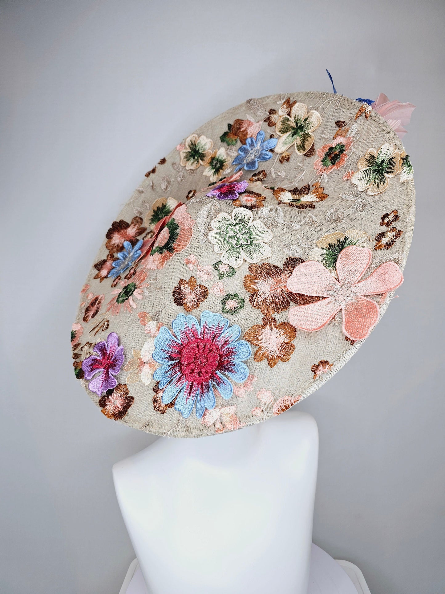 kentucky derby hat fascinator taupe beige neutral large saucer sinamay rainbow floral embroidered decor with pink blue branching feathers