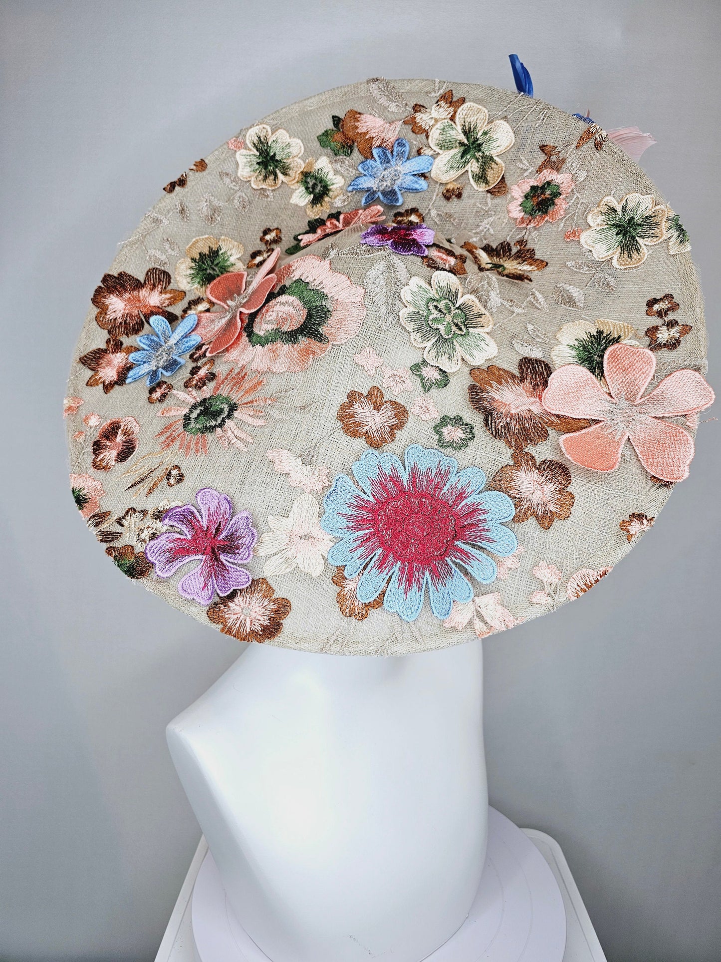 kentucky derby hat fascinator taupe beige neutral large saucer sinamay rainbow floral embroidered decor with pink blue branching feathers