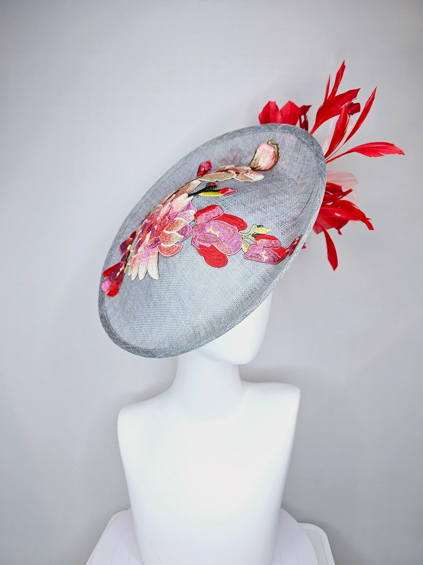 kentucky derby hat gray blue sinamay saucer with red burgundy pink embroidered flowers with blush light pink and red feathers