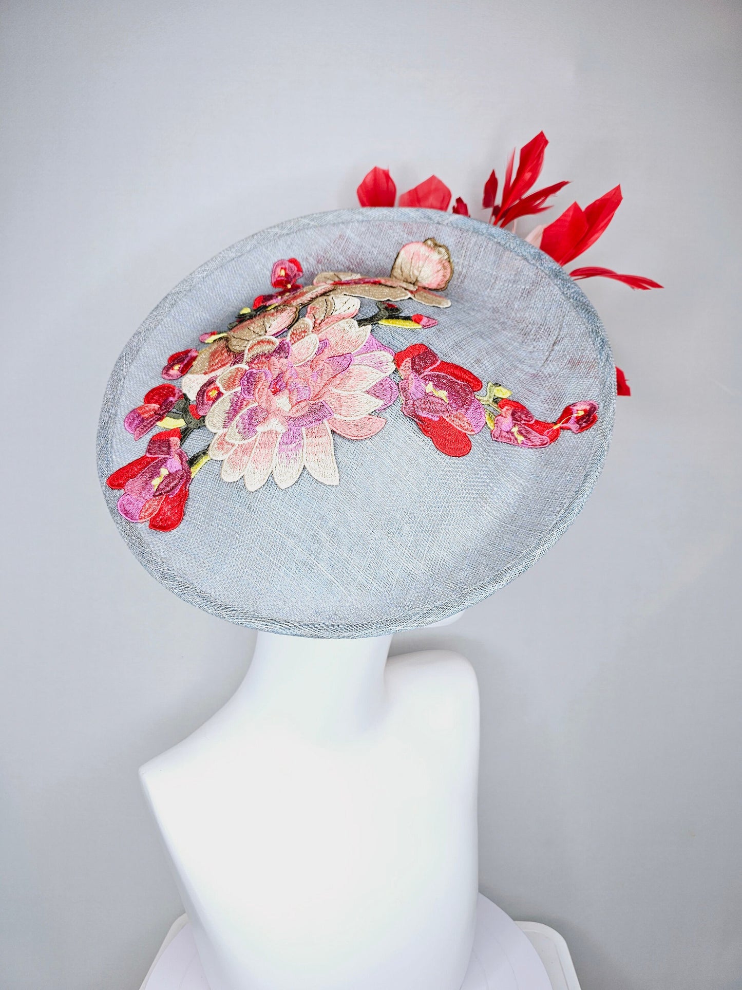 kentucky derby hat gray blue sinamay saucer with red burgundy pink embroidered flowers with blush light pink and red feathers