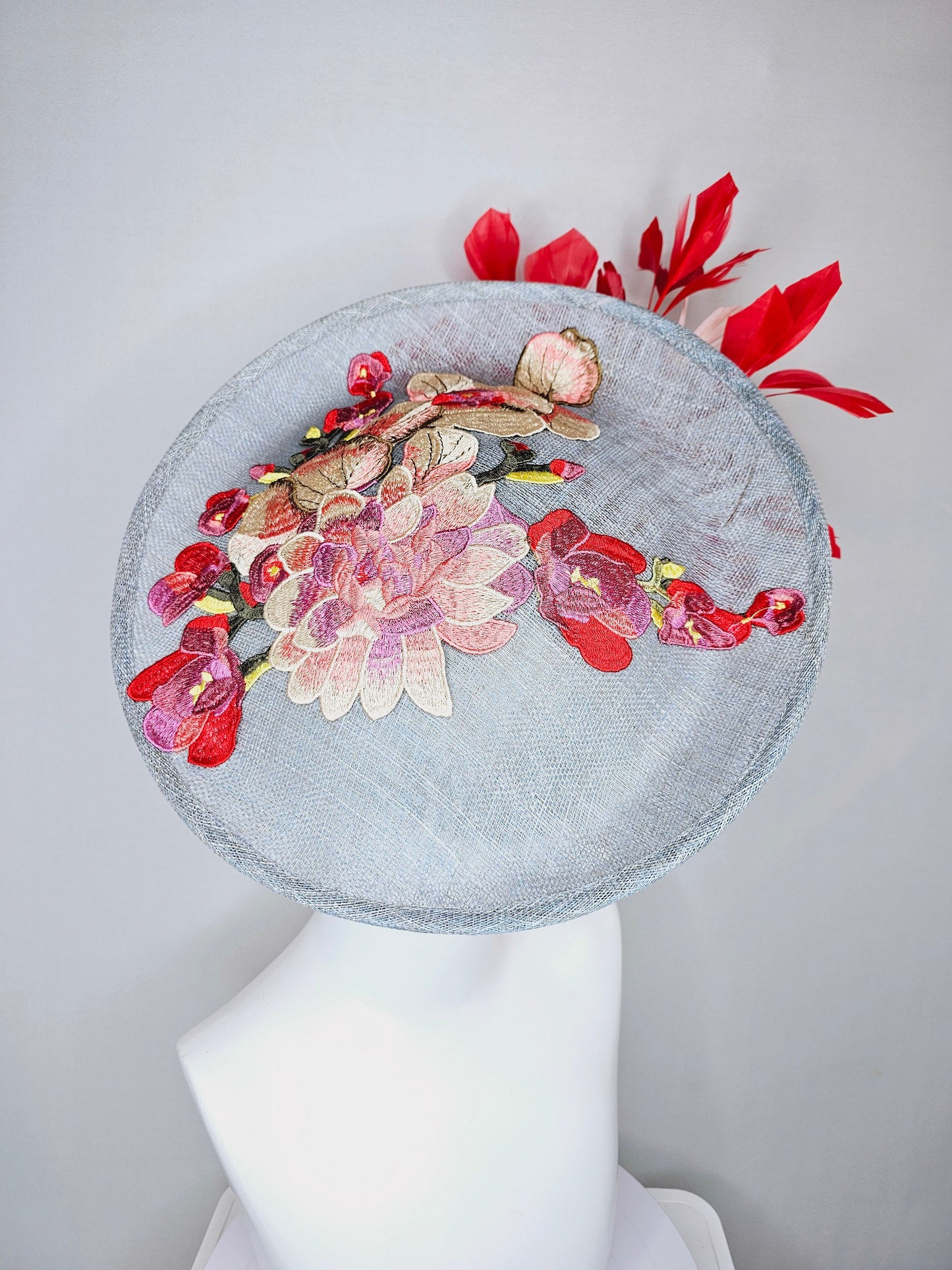 kentucky derby hat gray blue sinamay saucer with red burgundy pink embroidered flowers with blush light pink and red feathers