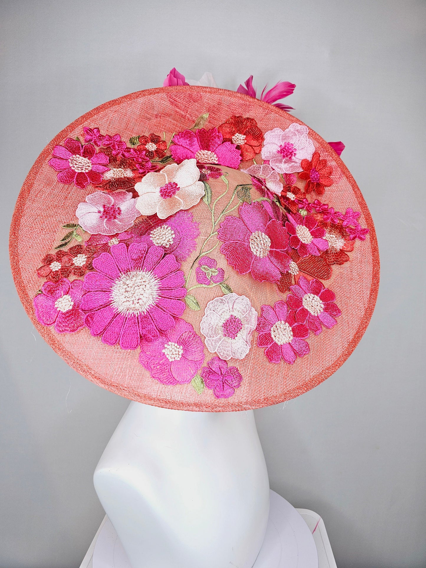 kentucky derby hat fascinator large coral red sinamay saucer with red pink green floral embroidered and hot pink and light pink feathers