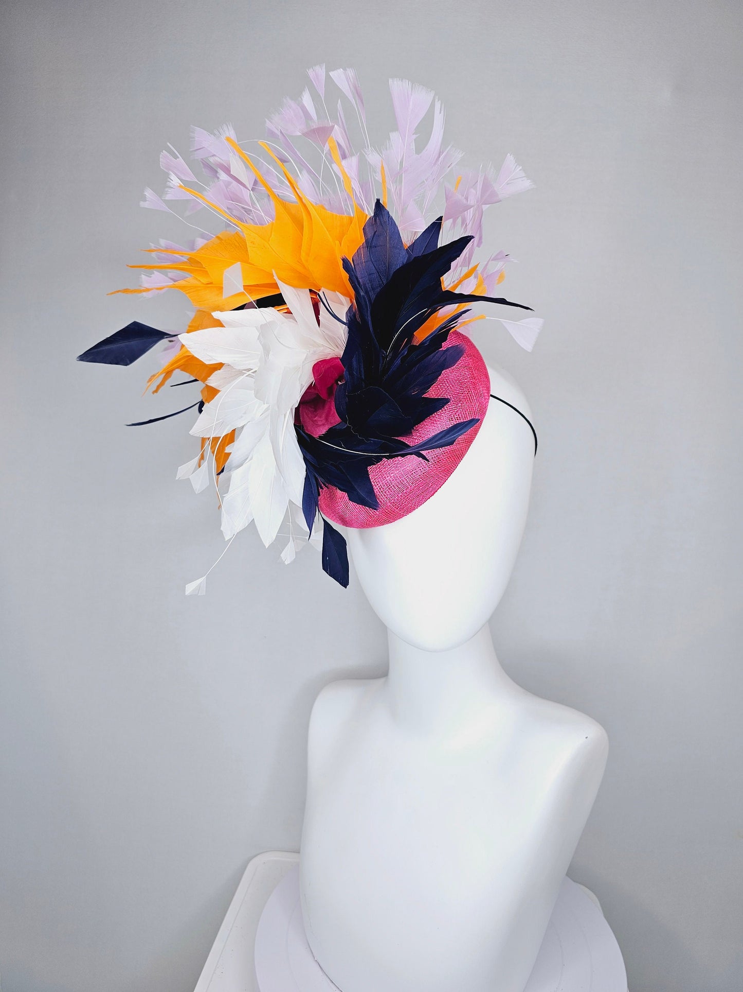 kentucky derby hat fascinator hot pink sinamay with navy blue, white ivory, apricot orange yellow, and lavender purple branching feathers