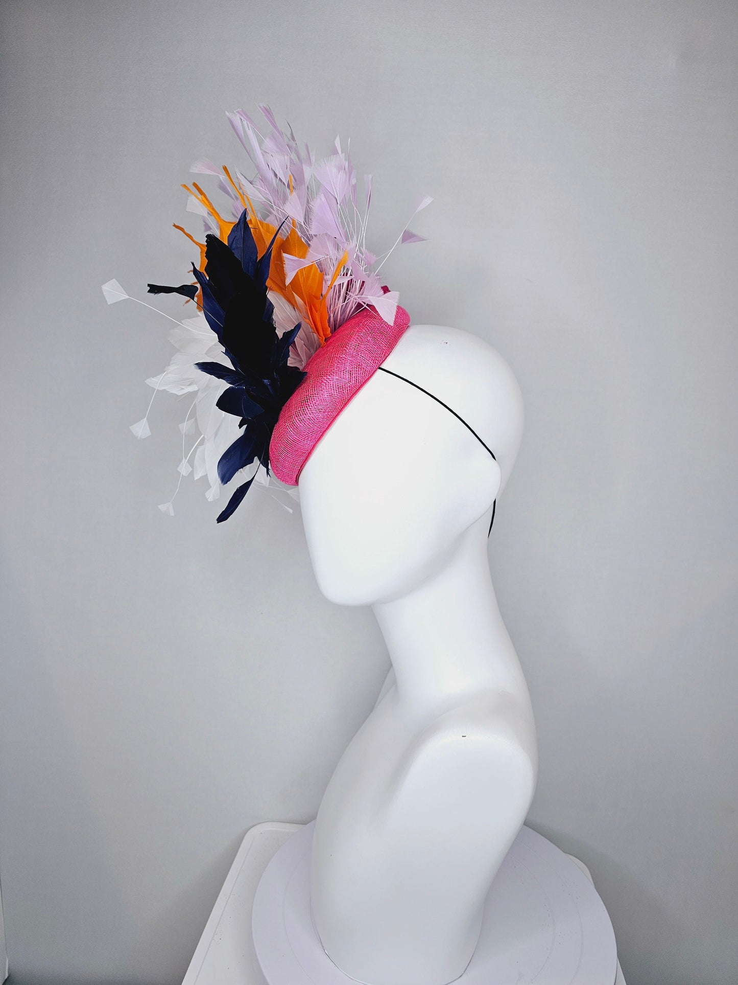 kentucky derby hat fascinator hot pink sinamay with navy blue, white ivory, apricot orange yellow, and lavender purple branching feathers