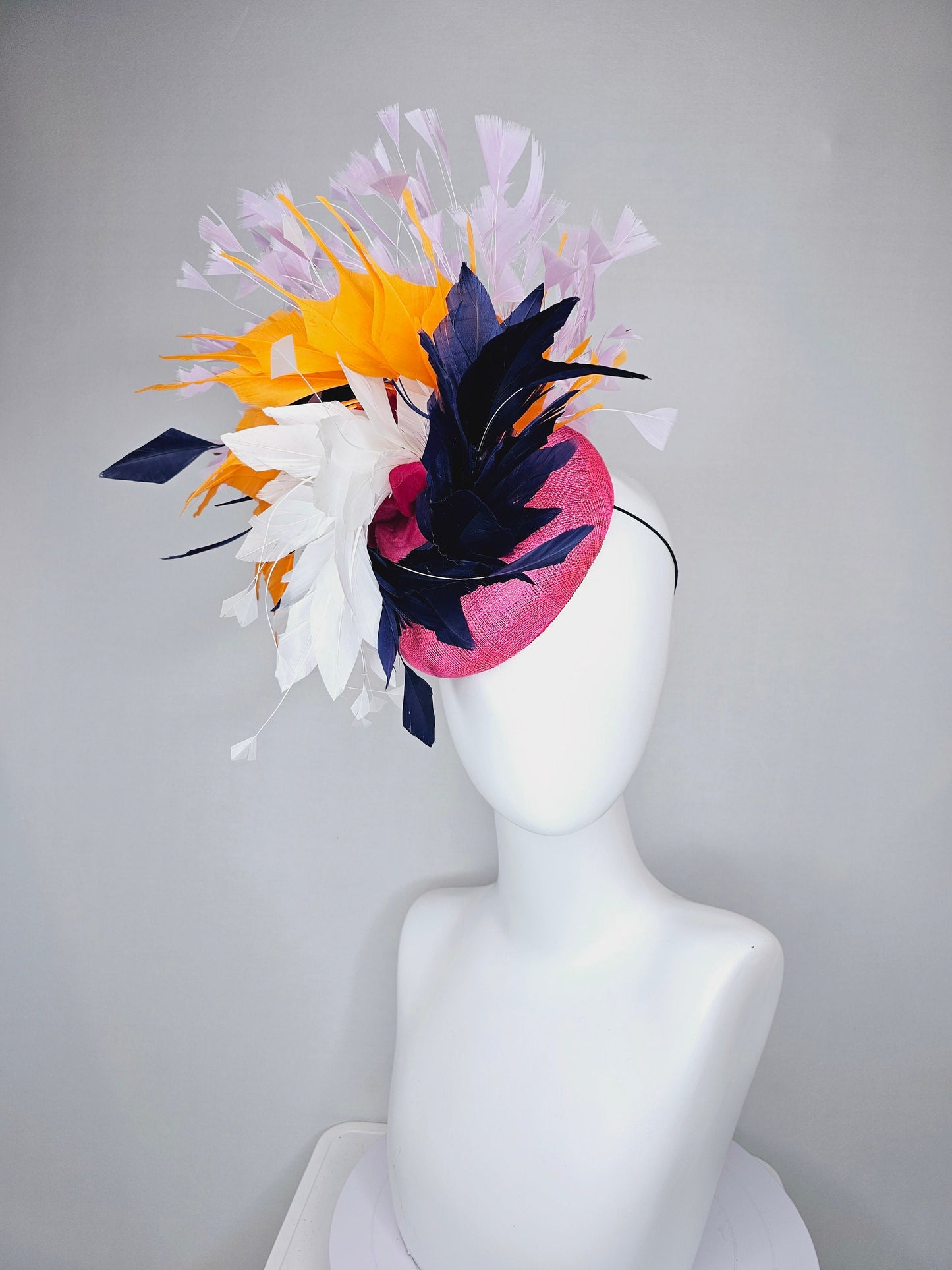 kentucky derby hat fascinator hot pink sinamay with navy blue, white ivory, apricot orange yellow, and lavender purple branching feathers