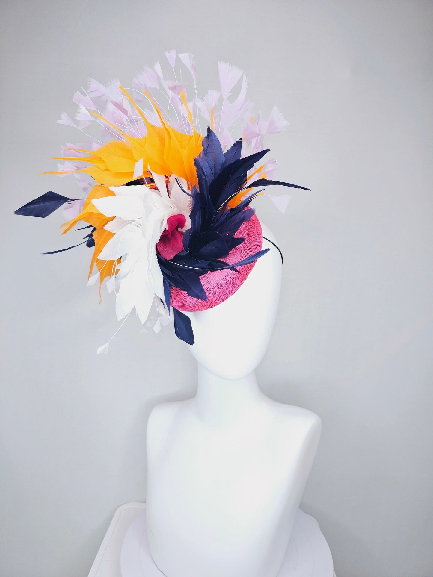 kentucky derby hat fascinator hot pink sinamay with navy blue, white ivory, apricot orange yellow, and lavender purple branching feathers