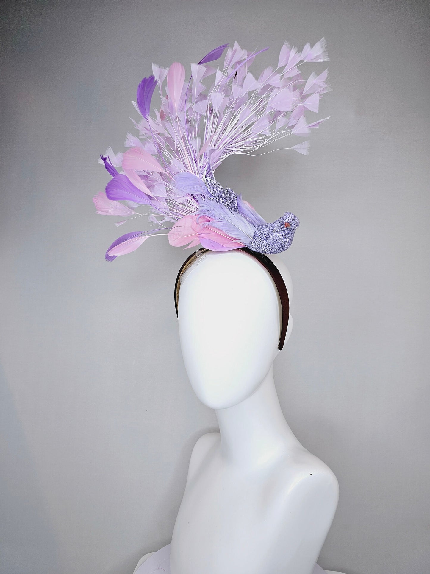 kentucky derby hat fascinator dark brown brunette satin headband with purple bird and purple lavender pink feathers