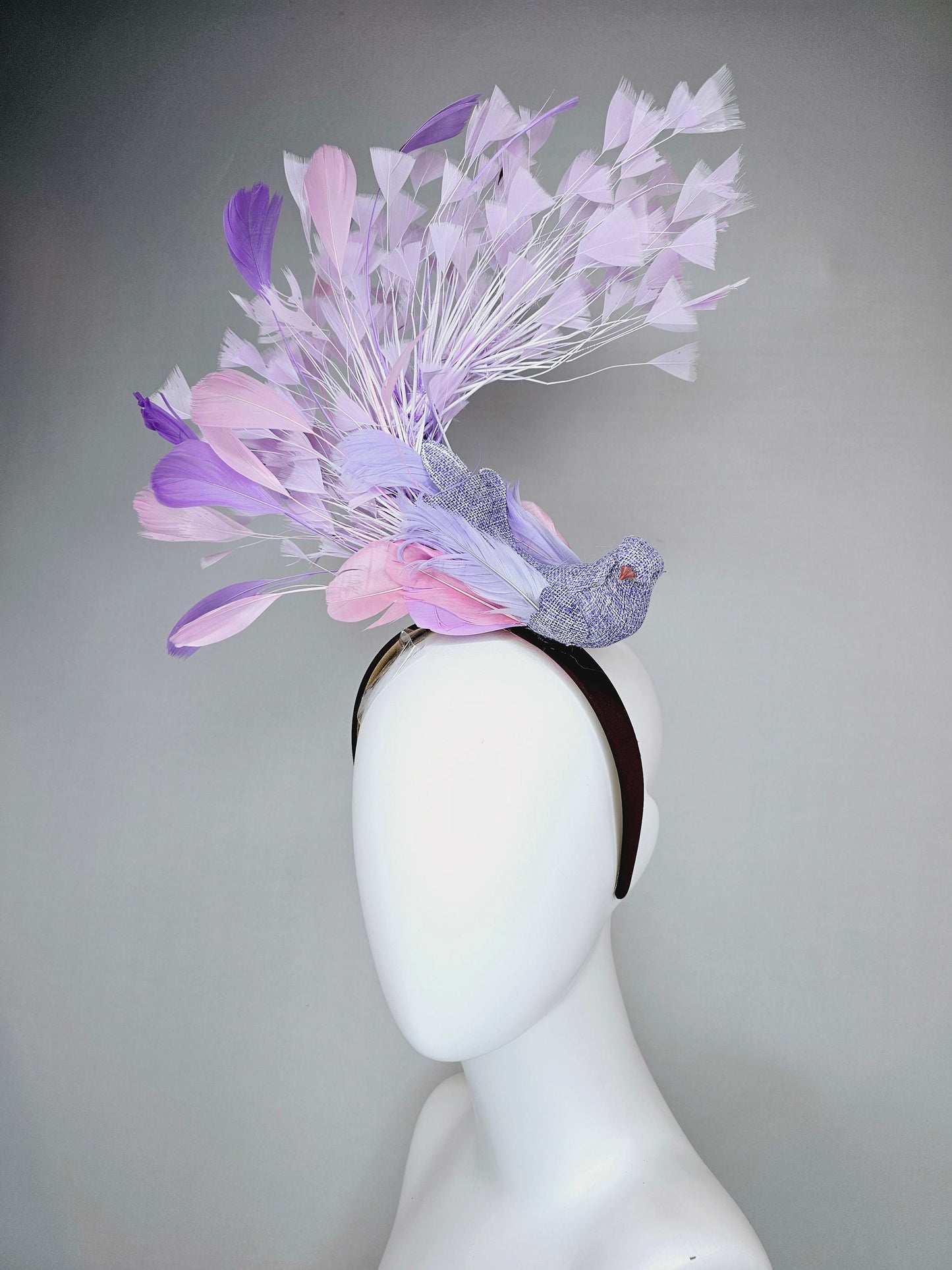 kentucky derby hat fascinator dark brown brunette satin headband with purple bird and purple lavender pink feathers