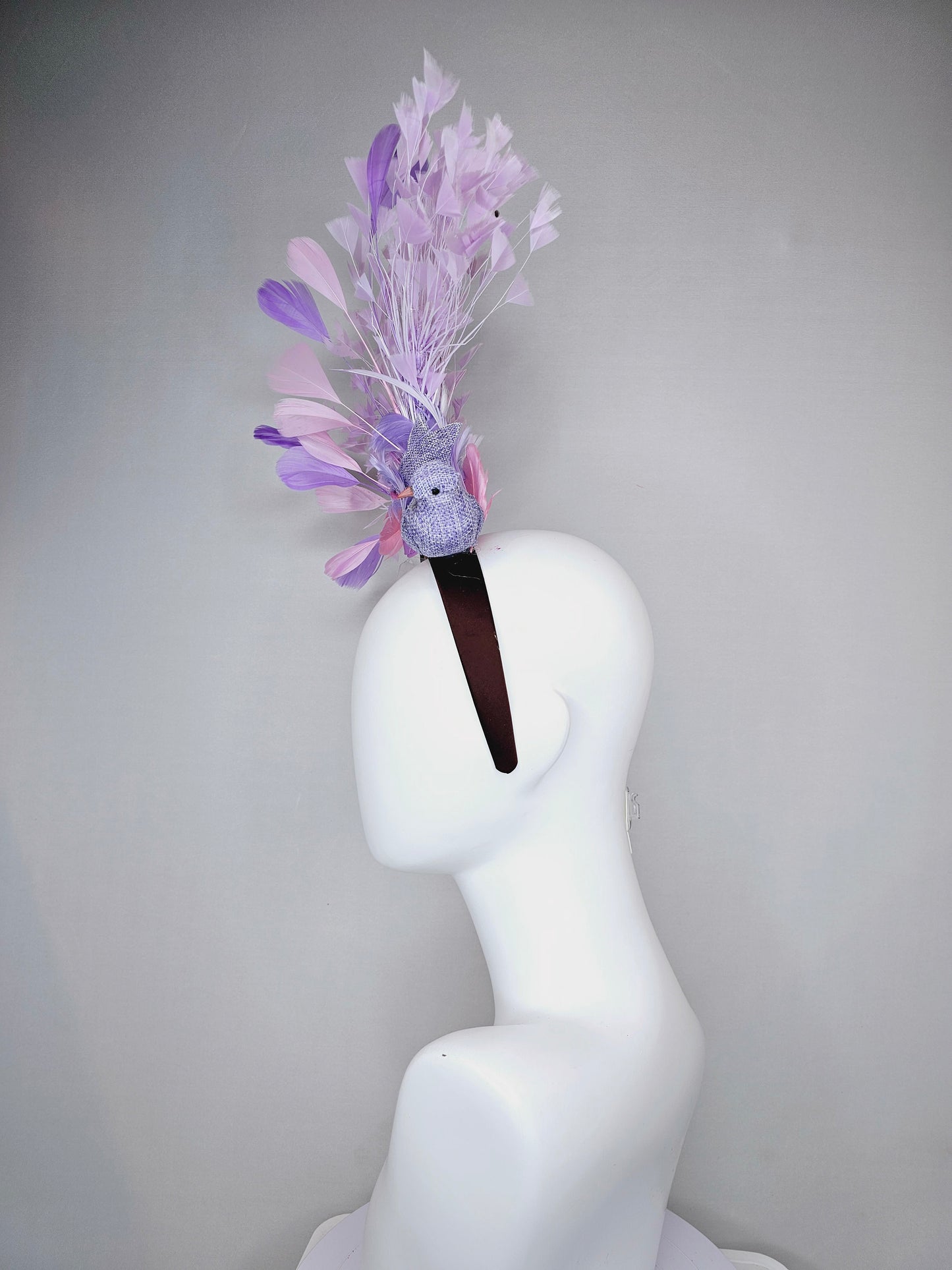 kentucky derby hat fascinator dark brown brunette satin headband with purple bird and purple lavender pink feathers