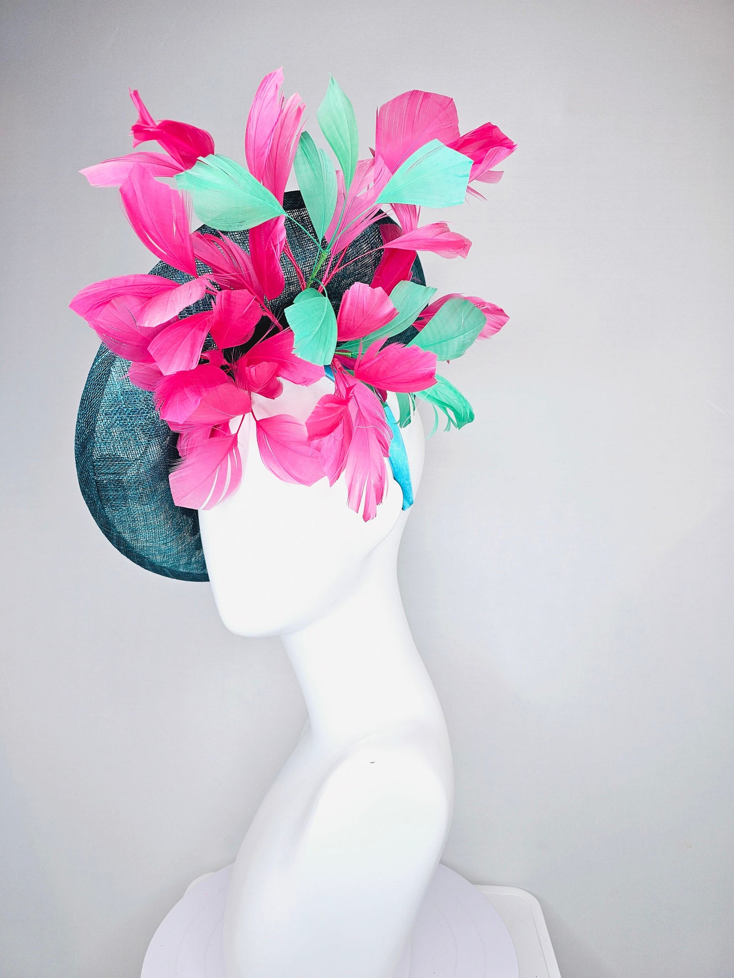 kentucky derby hat fascinator teal sinamay saucer with fuchsia pink and green feathers and yellow pink blue embroidered flowers and birds