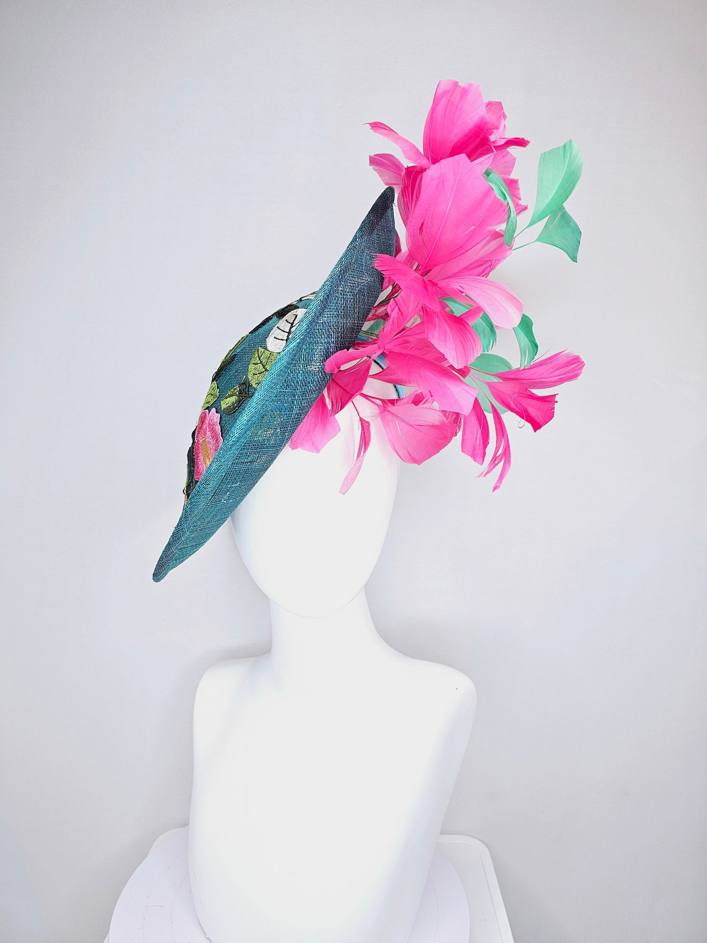 kentucky derby hat fascinator teal sinamay saucer with fuchsia pink and green feathers and yellow pink blue embroidered flowers and birds