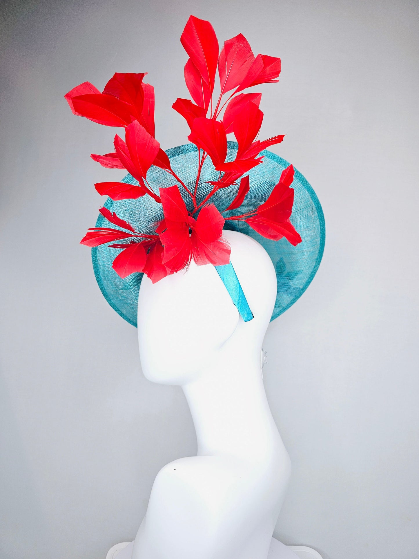 kentucky derby hat fascinator teal turquoise aqua blue sinamay saucer with purple red gold green embroidered flowers with red feathers