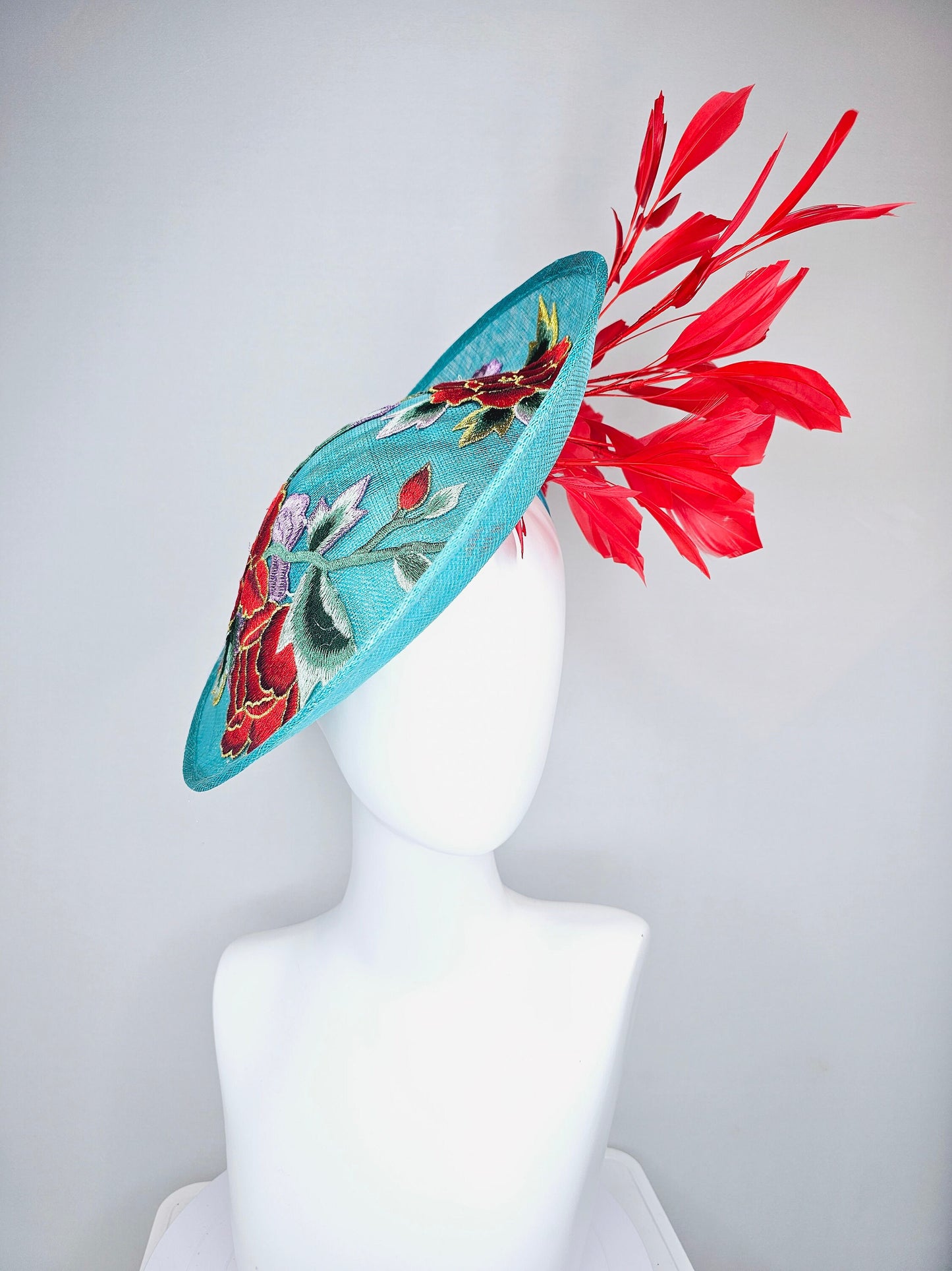 kentucky derby hat fascinator teal turquoise aqua blue sinamay saucer with purple red gold green embroidered flowers with red feathers