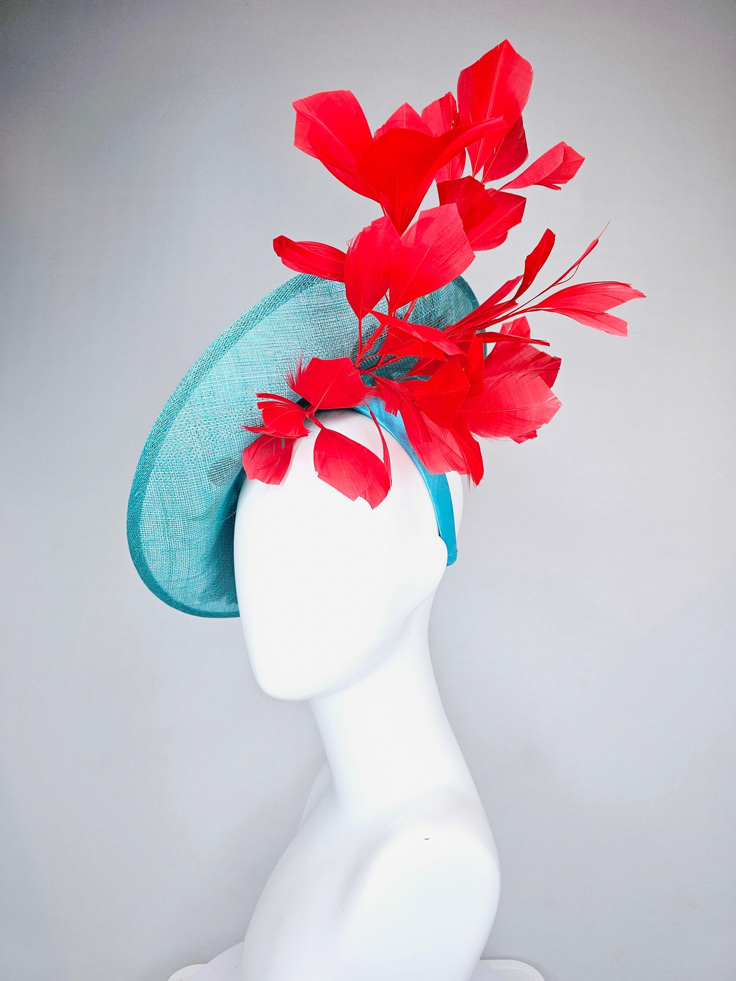 kentucky derby hat fascinator teal turquoise aqua blue sinamay saucer with purple red gold green embroidered flowers with red feathers