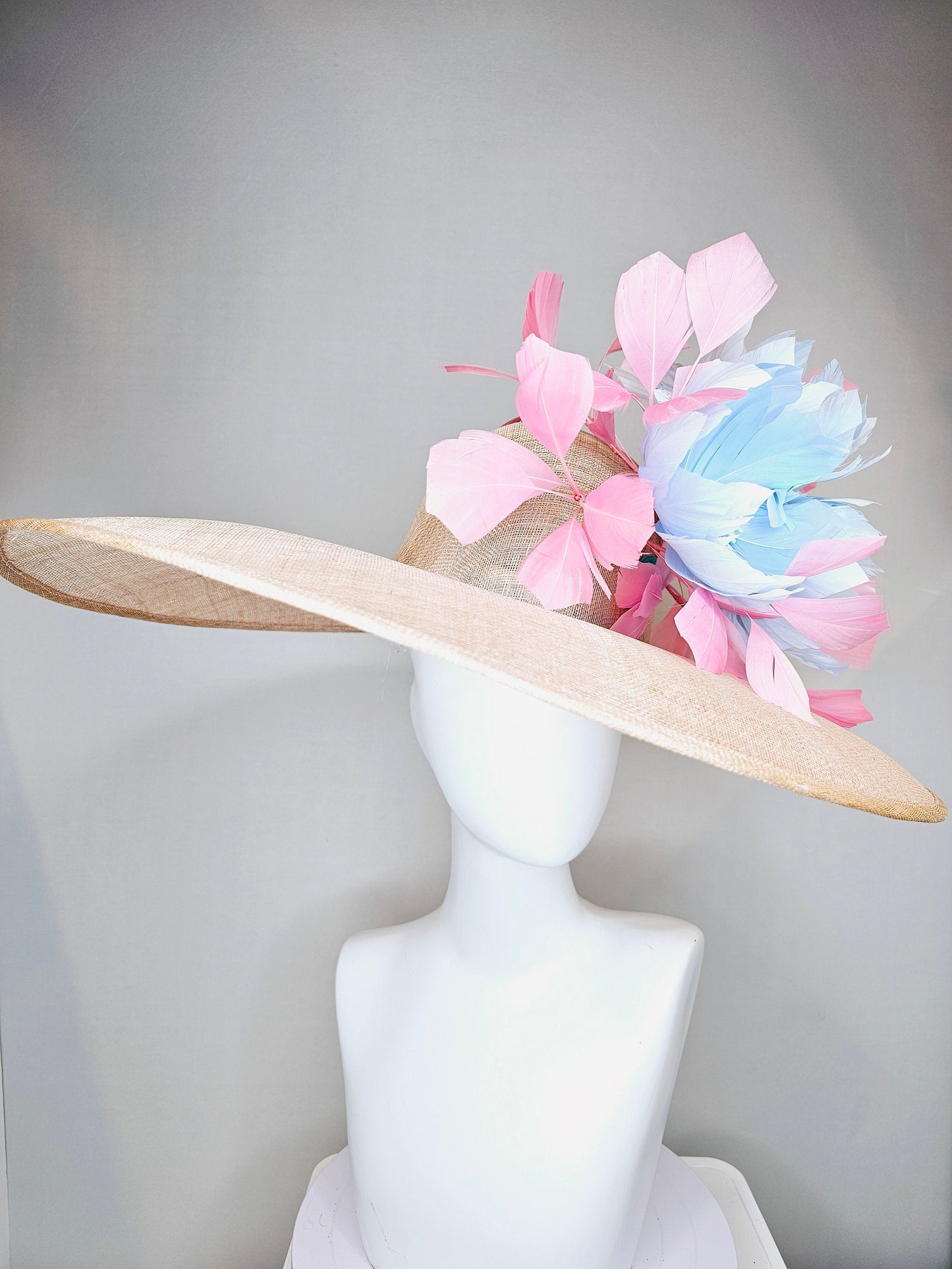 kentucky derby hat large wide brim sinamay neutral beige hat with light baby pink feathers and light baby blue fluffy feather flowers