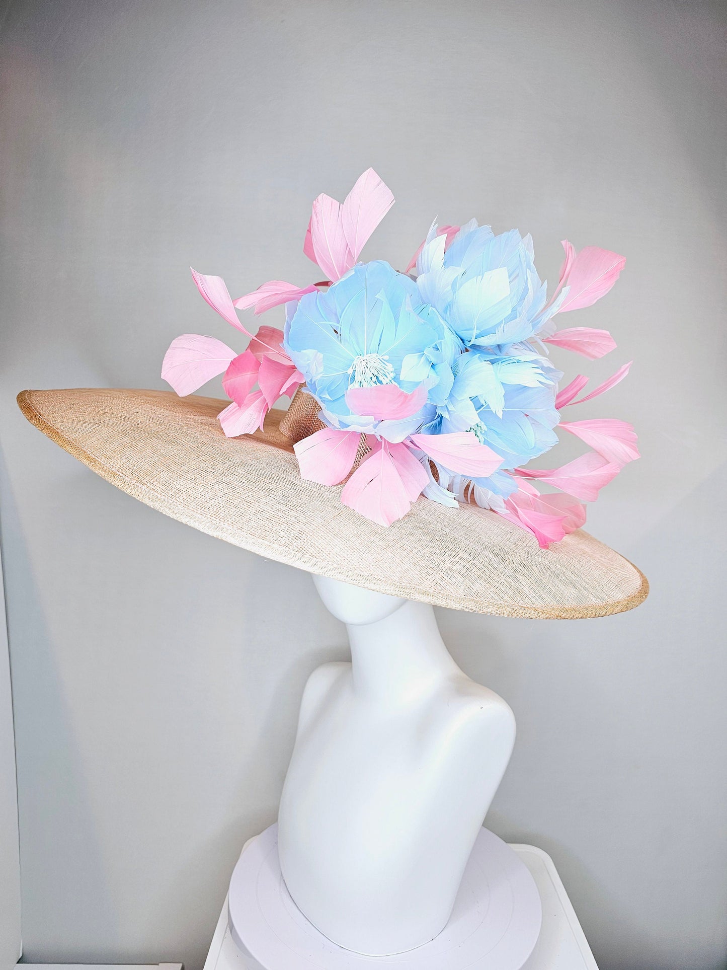 kentucky derby hat large wide brim sinamay neutral beige hat with light baby pink feathers and light baby blue fluffy feather flowers