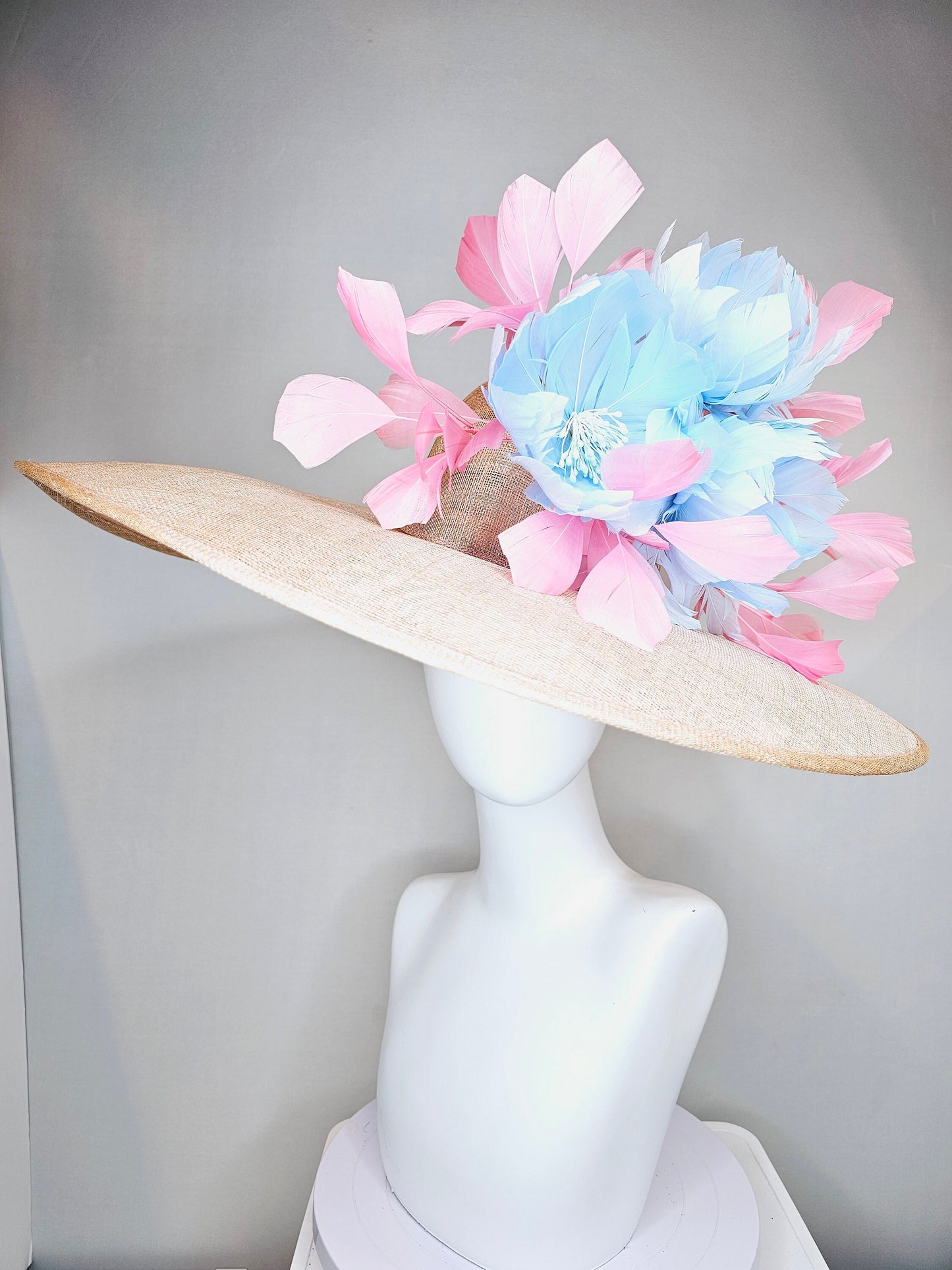 kentucky derby hat large wide brim sinamay neutral beige hat with light baby pink feathers and light baby blue fluffy feather flowers