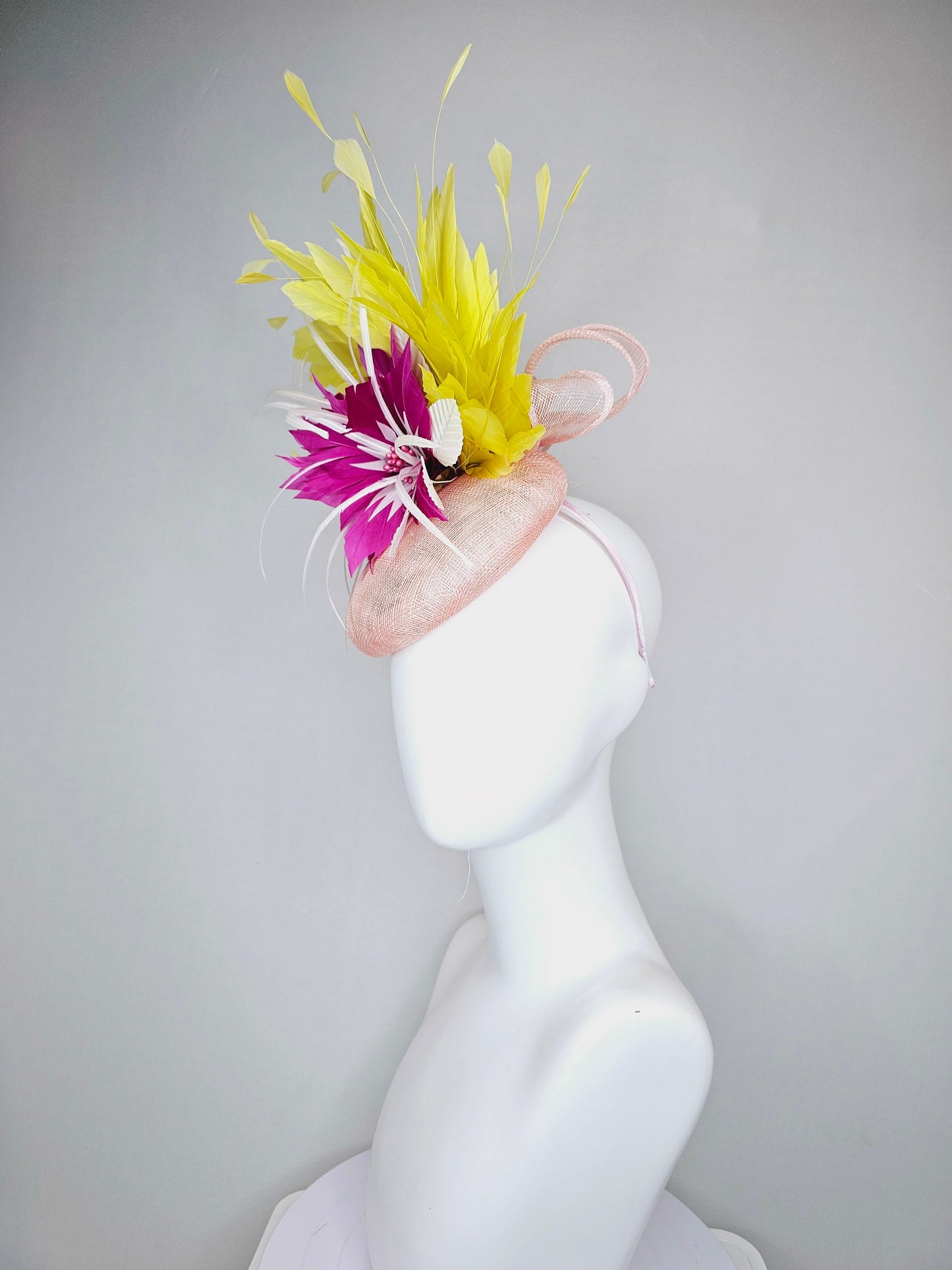 kentucky derby hat fascinator light pink sinamay with large fuchsia pink and white feather flowers,and branching bright yellow feathers