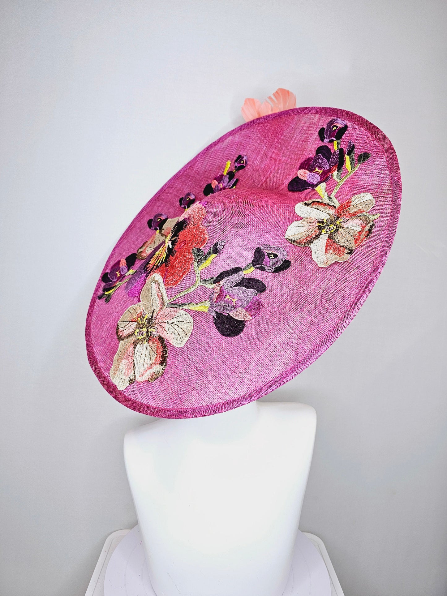 kentucky derby hat fascinator large pink sinamay saucer with yellow coral purple pink ivory embroidered flowers and orange yellow feathers