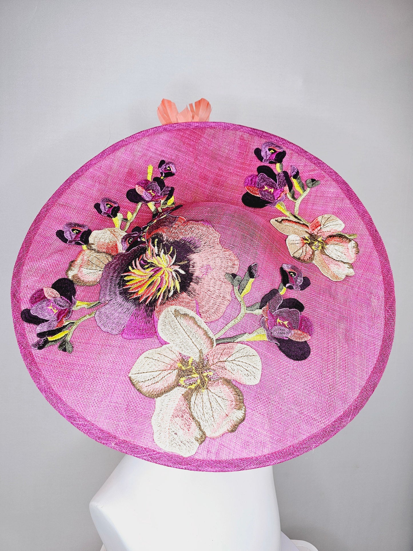 kentucky derby hat fascinator large pink sinamay saucer with yellow coral purple pink ivory embroidered flowers and orange yellow feathers