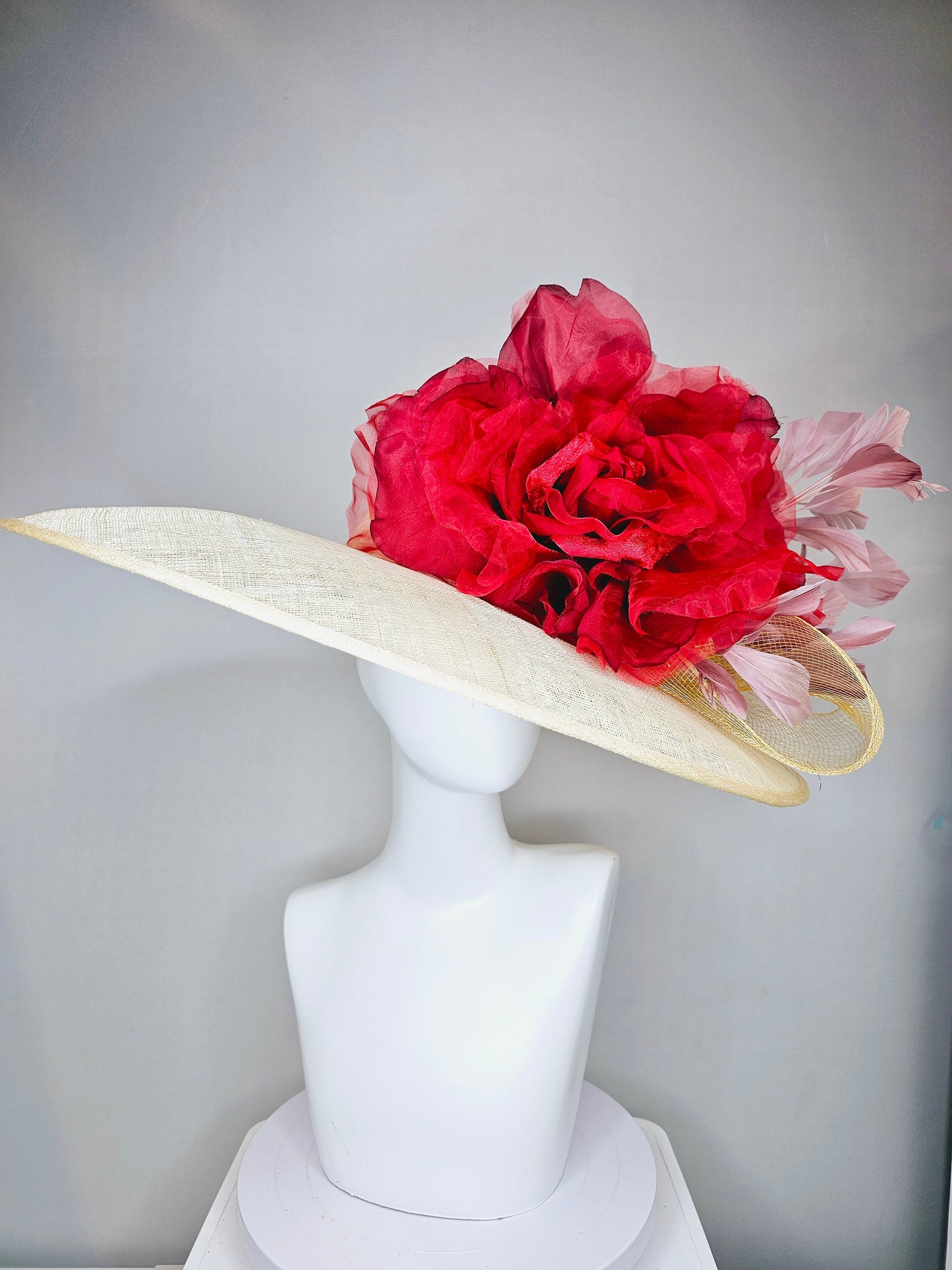 kentucky derby hat large wide brim sinamay neutral taupe beige hat with large red organza flower and blush pink feathers with gold crinoline