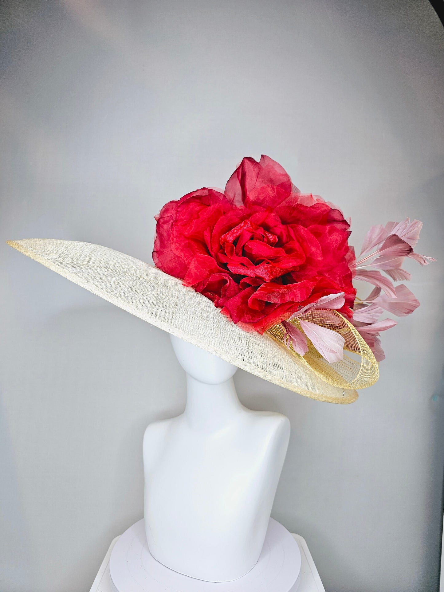 kentucky derby hat large wide brim sinamay neutral taupe beige hat with large red organza flower and blush pink feathers with gold crinoline