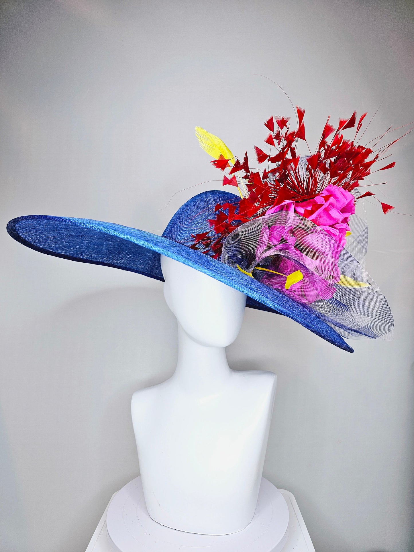 kentucky derby hat large wide brim sinamay royal blue hat with red and yellow feathers, bright pink satin flower w gingham plaid crinoline