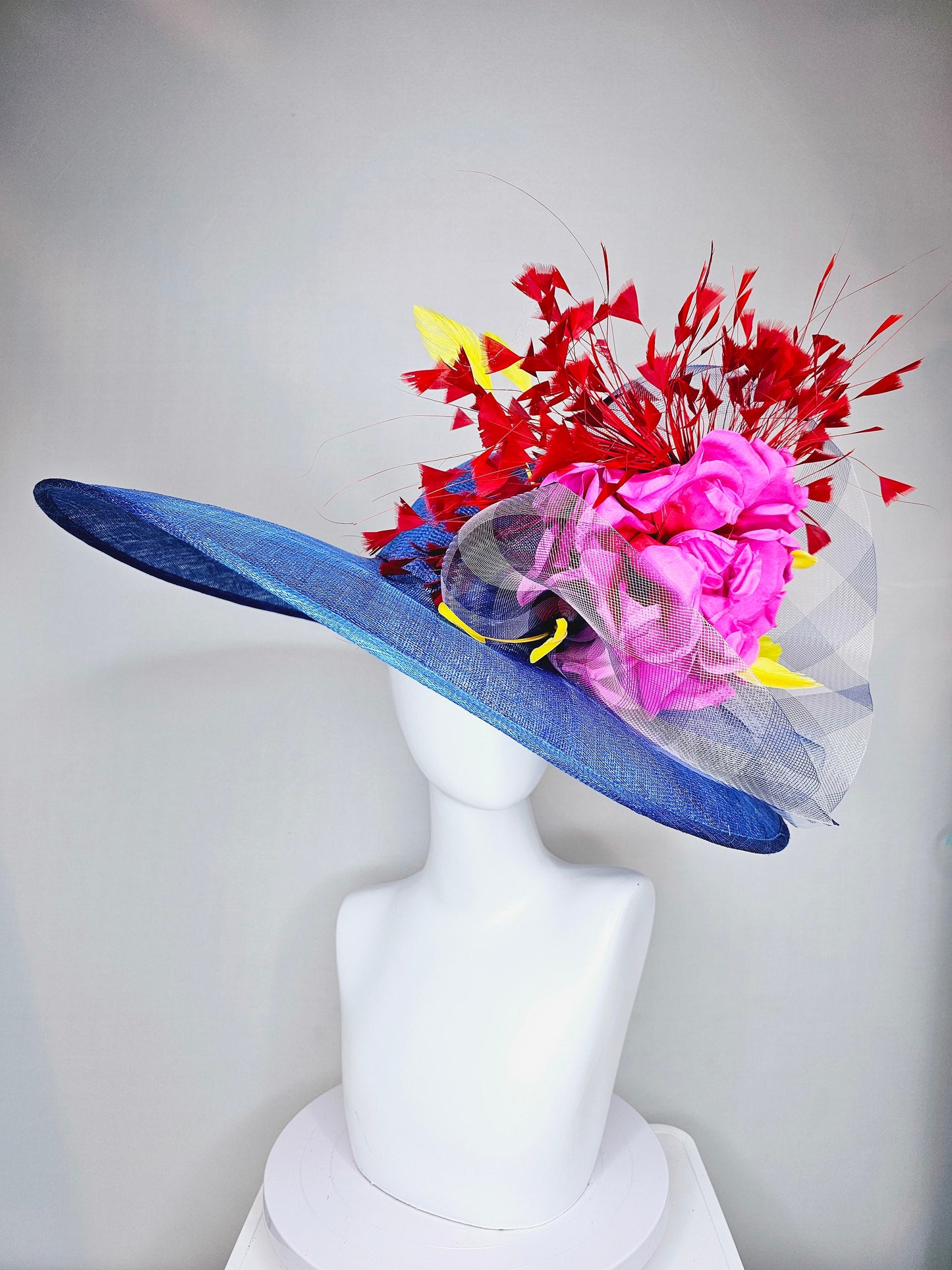 kentucky derby hat large wide brim sinamay royal blue hat with red and yellow feathers, bright pink satin flower w gingham plaid crinoline