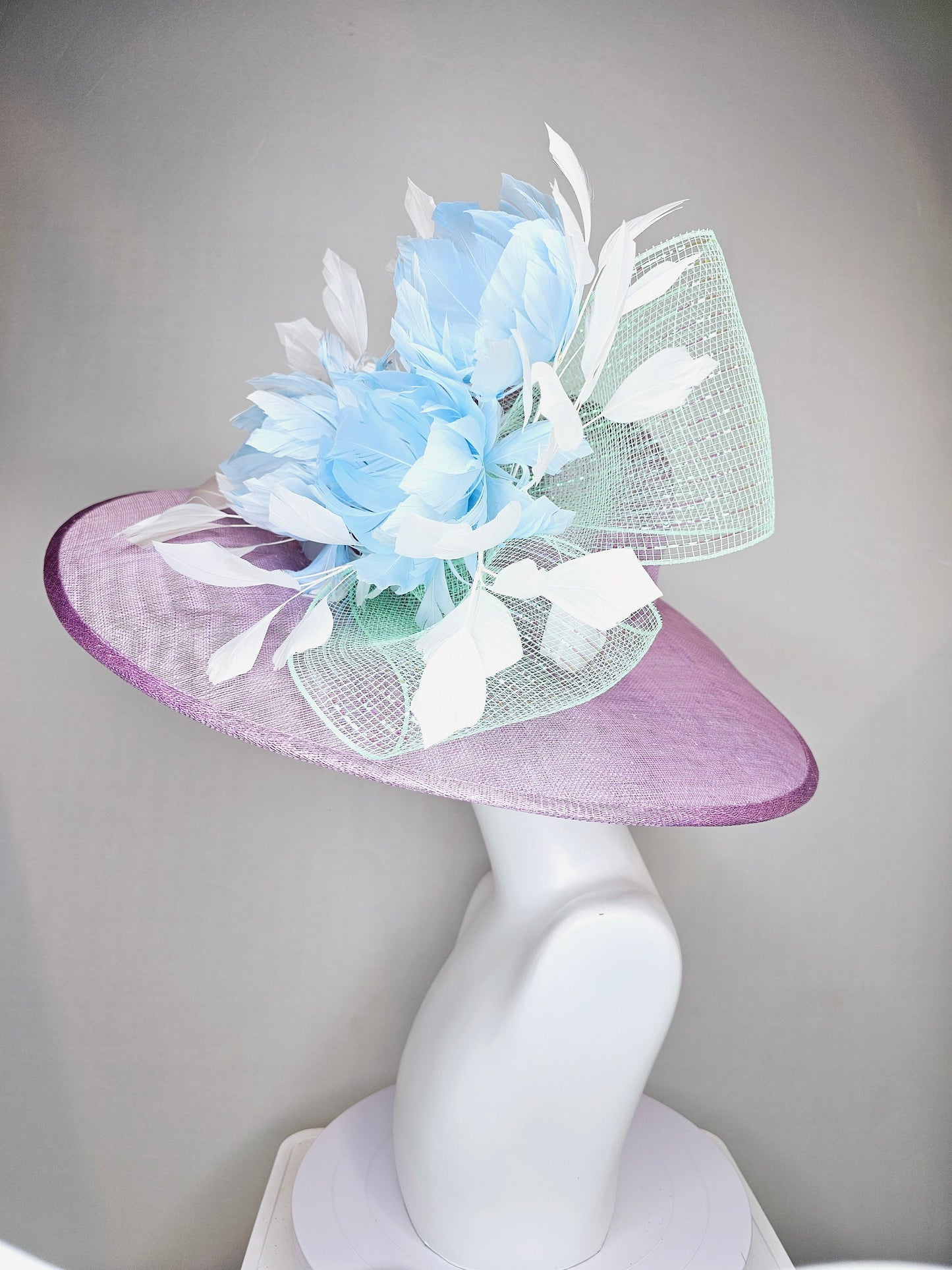 kentucky derby hat large wide brim sinamay purple lavender hat with baby blue feather flowers, white ivory feathers and mint green crinoline