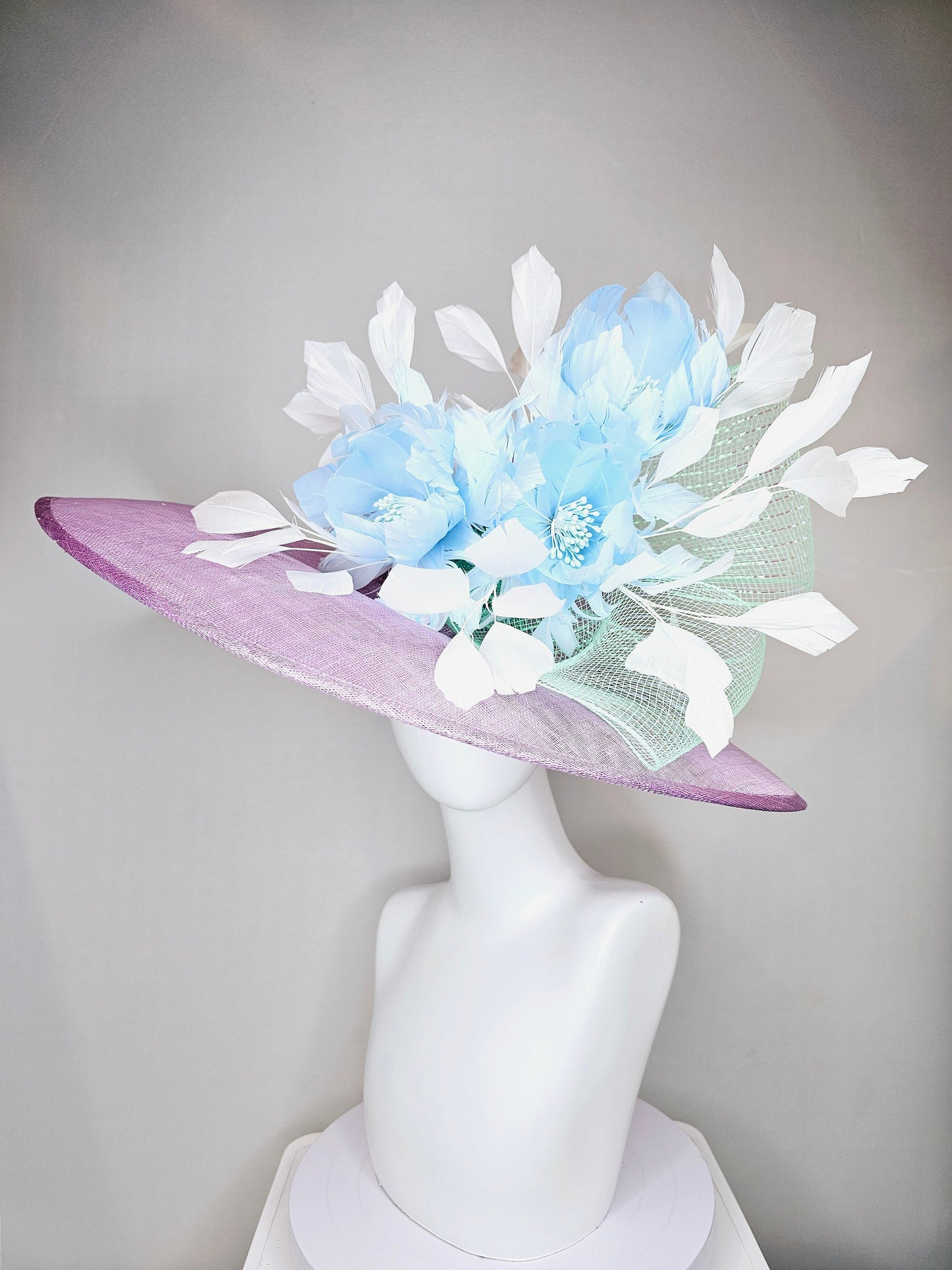 kentucky derby hat large wide brim sinamay purple lavender hat with baby blue feather flowers, white ivory feathers and mint green crinoline