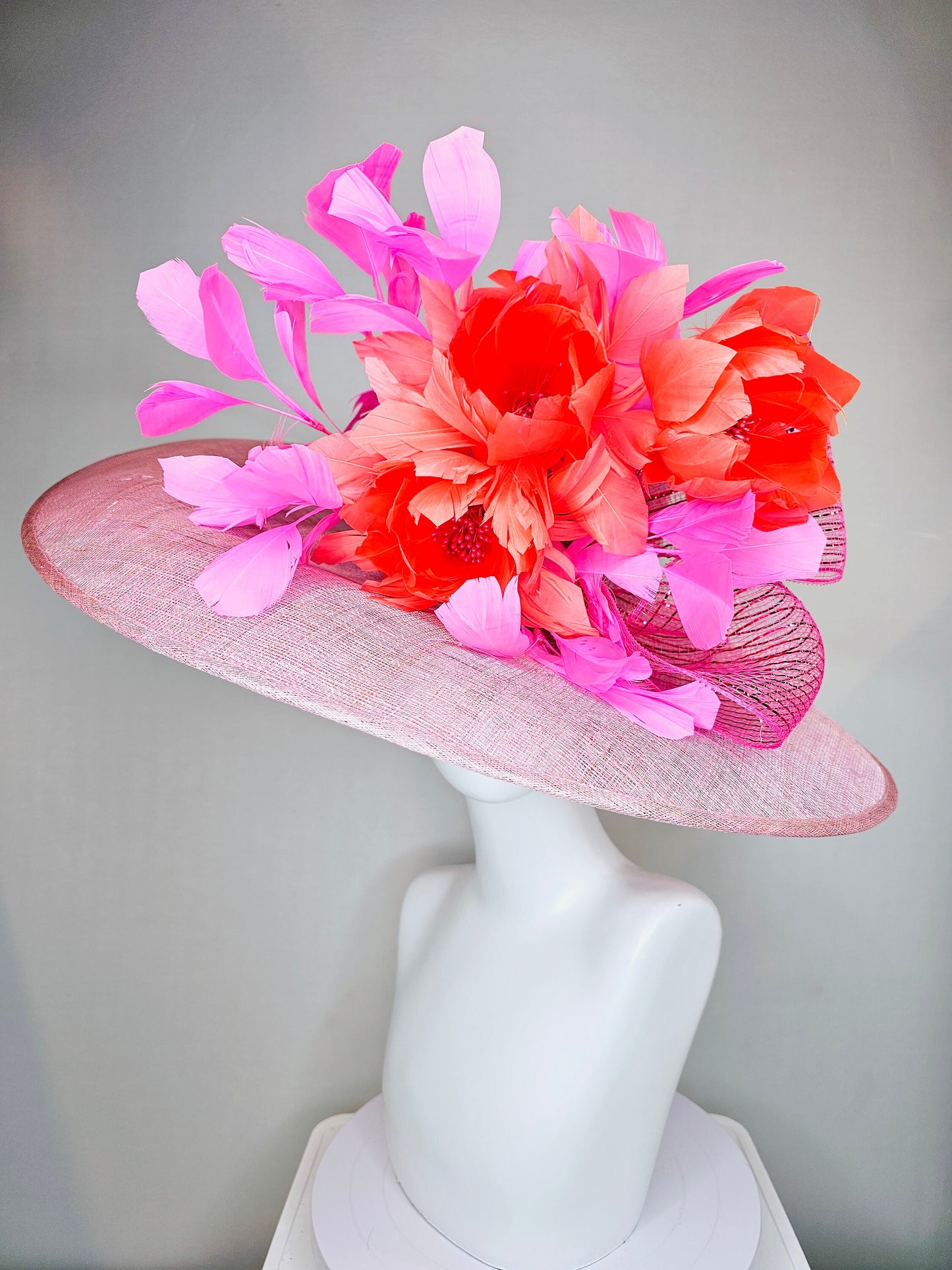 kentucky derby hat large wide brim sinamay light pink hat with large orange coral feather flowers and fuchsia pink feathers w pink crinoline