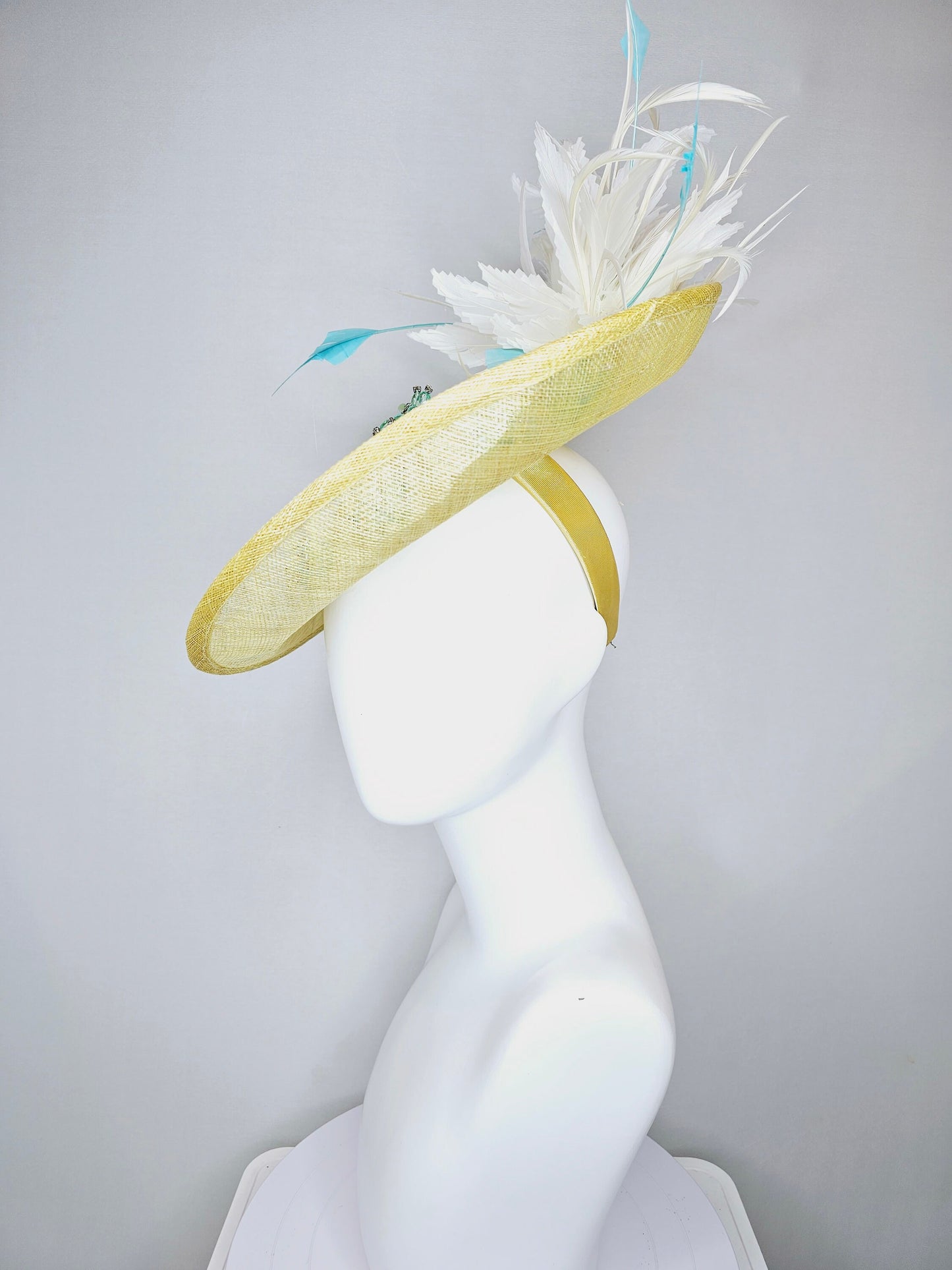 kentucky derby hat fascinator yellow sinamay saucer with white and blue feathers with blue crystal jewel beaded flowers