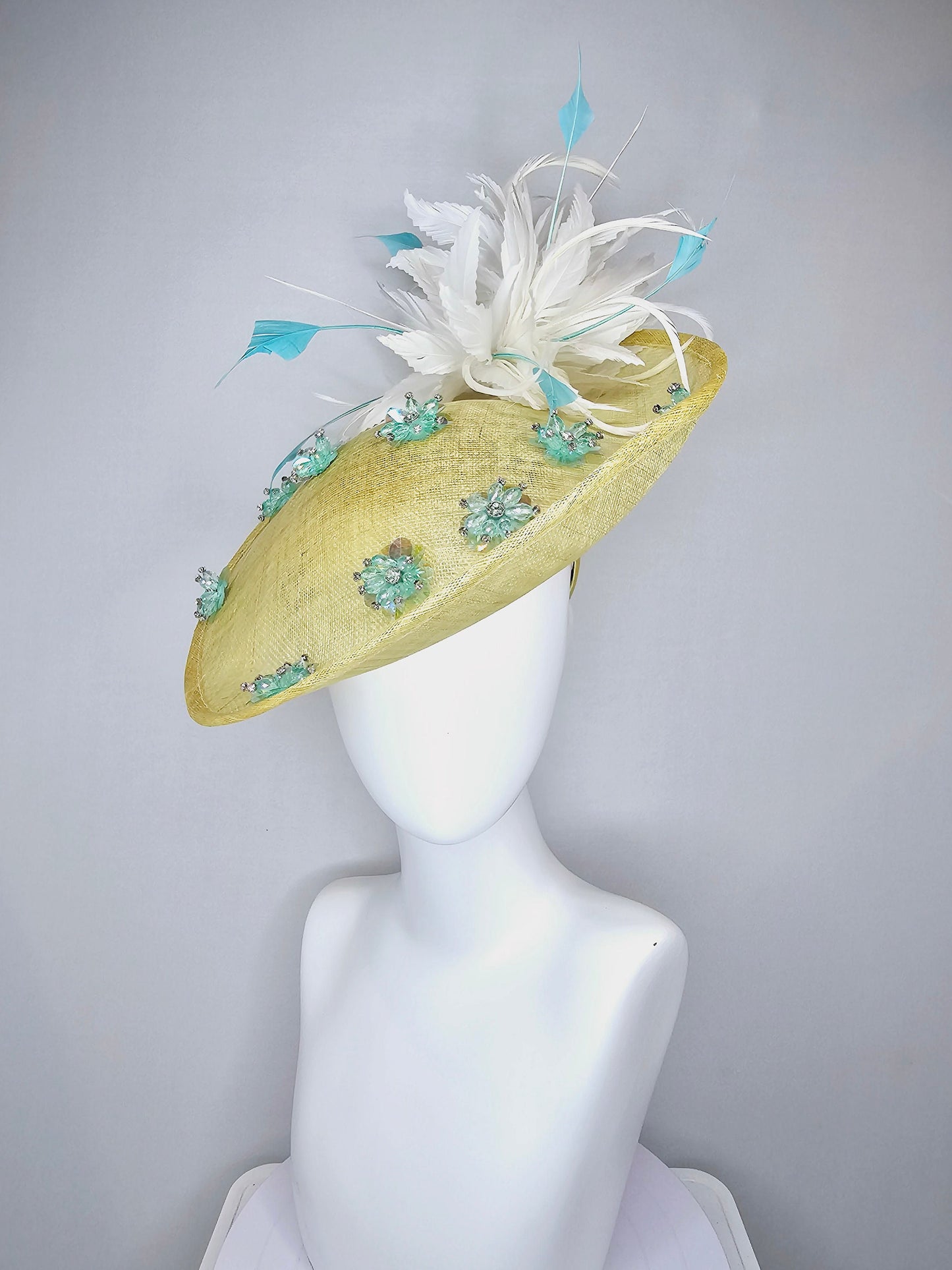 kentucky derby hat fascinator yellow sinamay saucer with white and blue feathers with blue crystal jewel beaded flowers