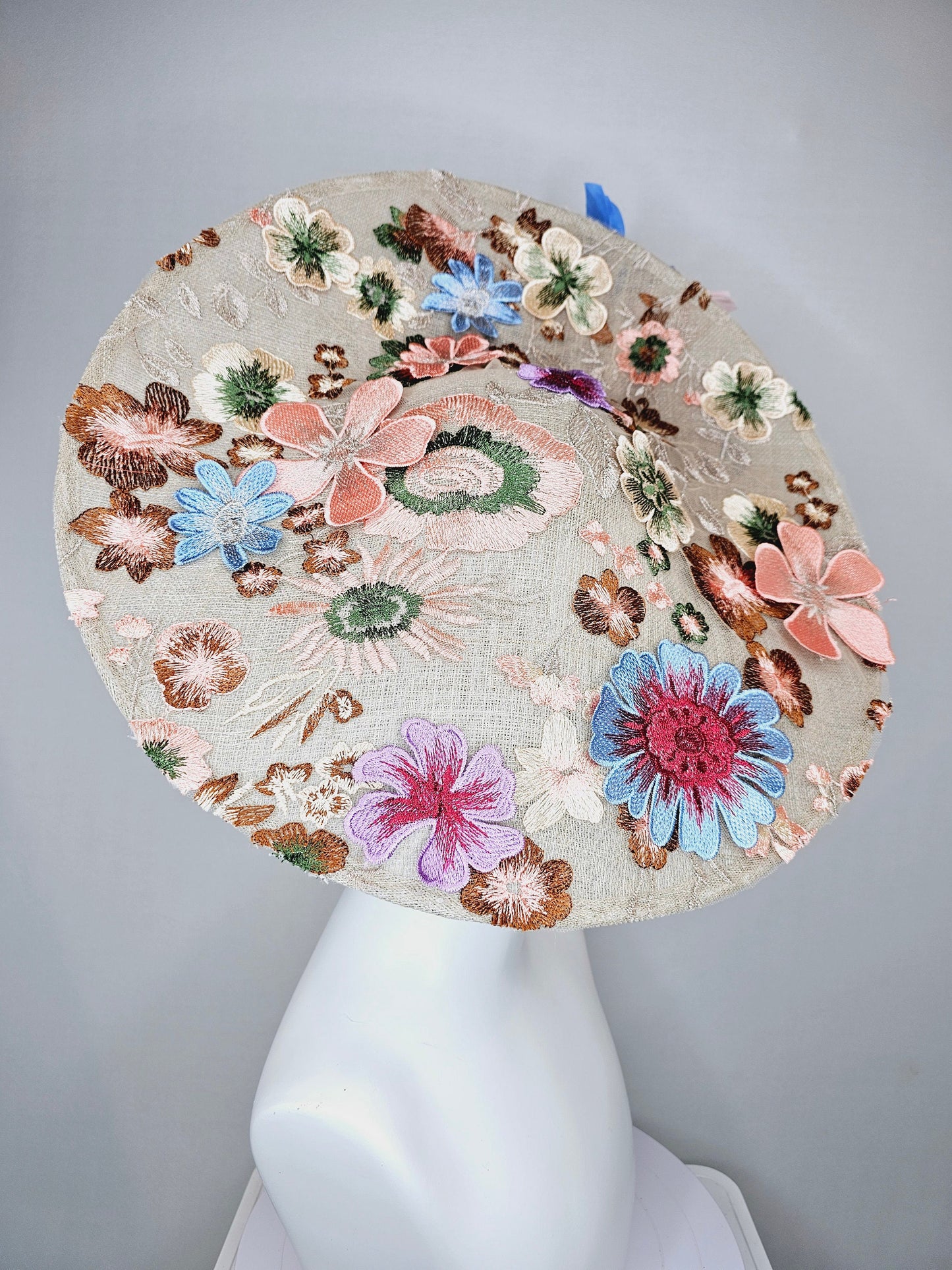 kentucky derby hat fascinator taupe beige neutral large saucer sinamay rainbow floral embroidered decor with pink blue branching feathers