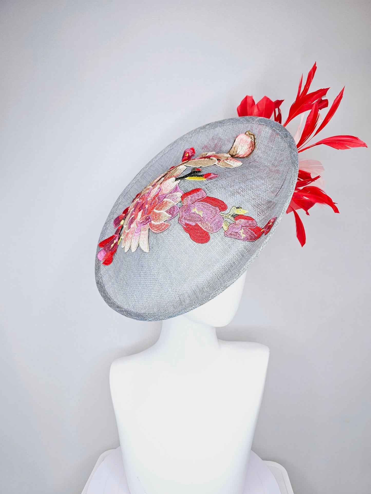 kentucky derby hat gray blue sinamay saucer with red burgundy pink embroidered flowers with blush light pink and red feathers