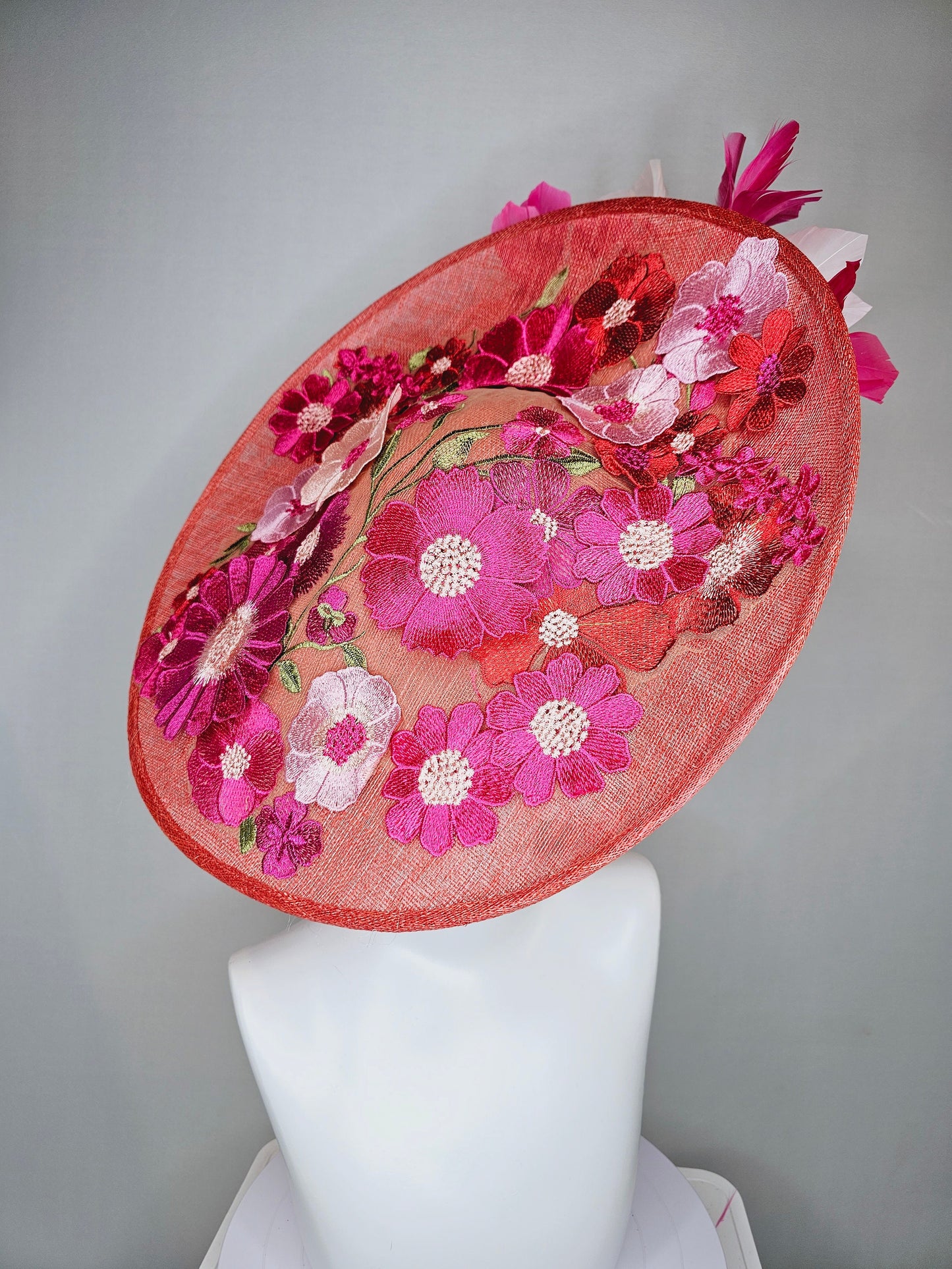 kentucky derby hat fascinator large coral red sinamay saucer with red pink green floral embroidered and hot pink and light pink feathers