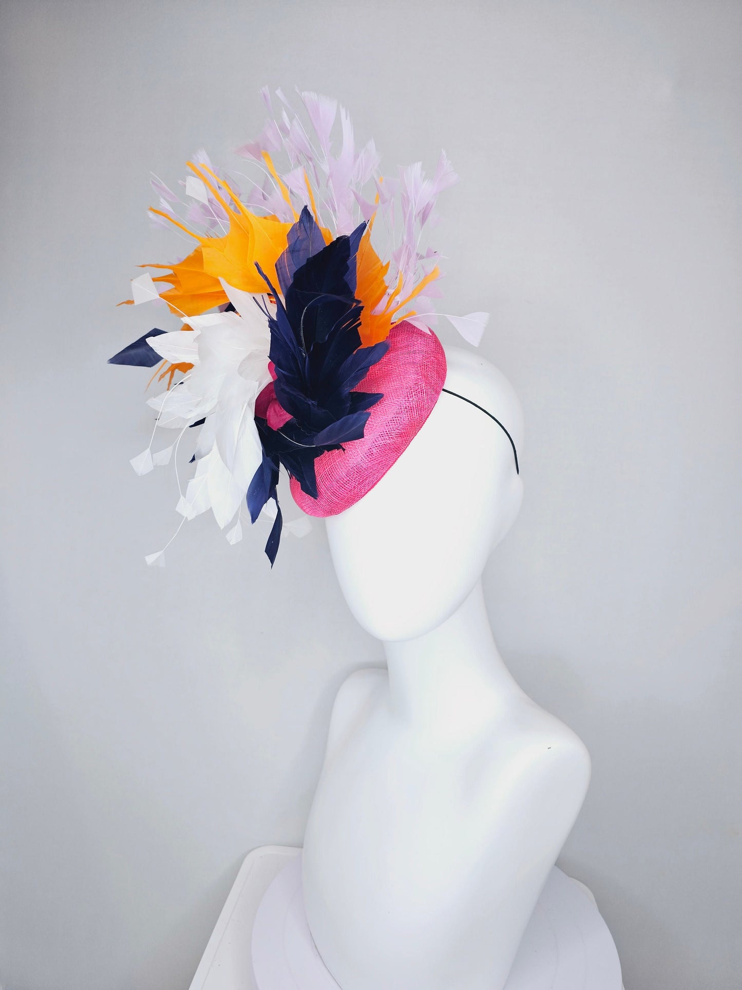 kentucky derby hat fascinator hot pink sinamay with navy blue, white ivory, apricot orange yellow, and lavender purple branching feathers