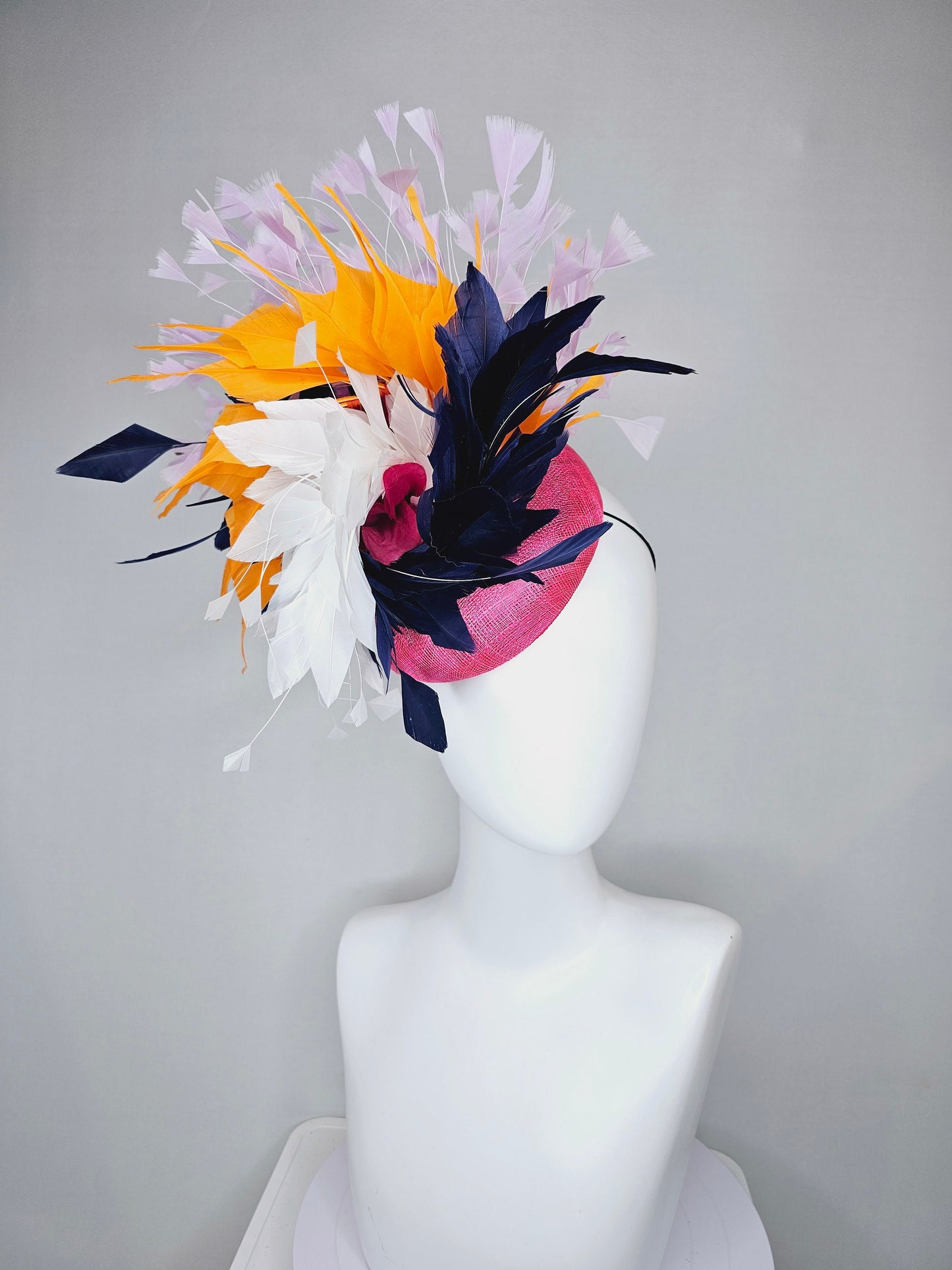 kentucky derby hat fascinator hot pink sinamay with navy blue, white ivory, apricot orange yellow, and lavender purple branching feathers