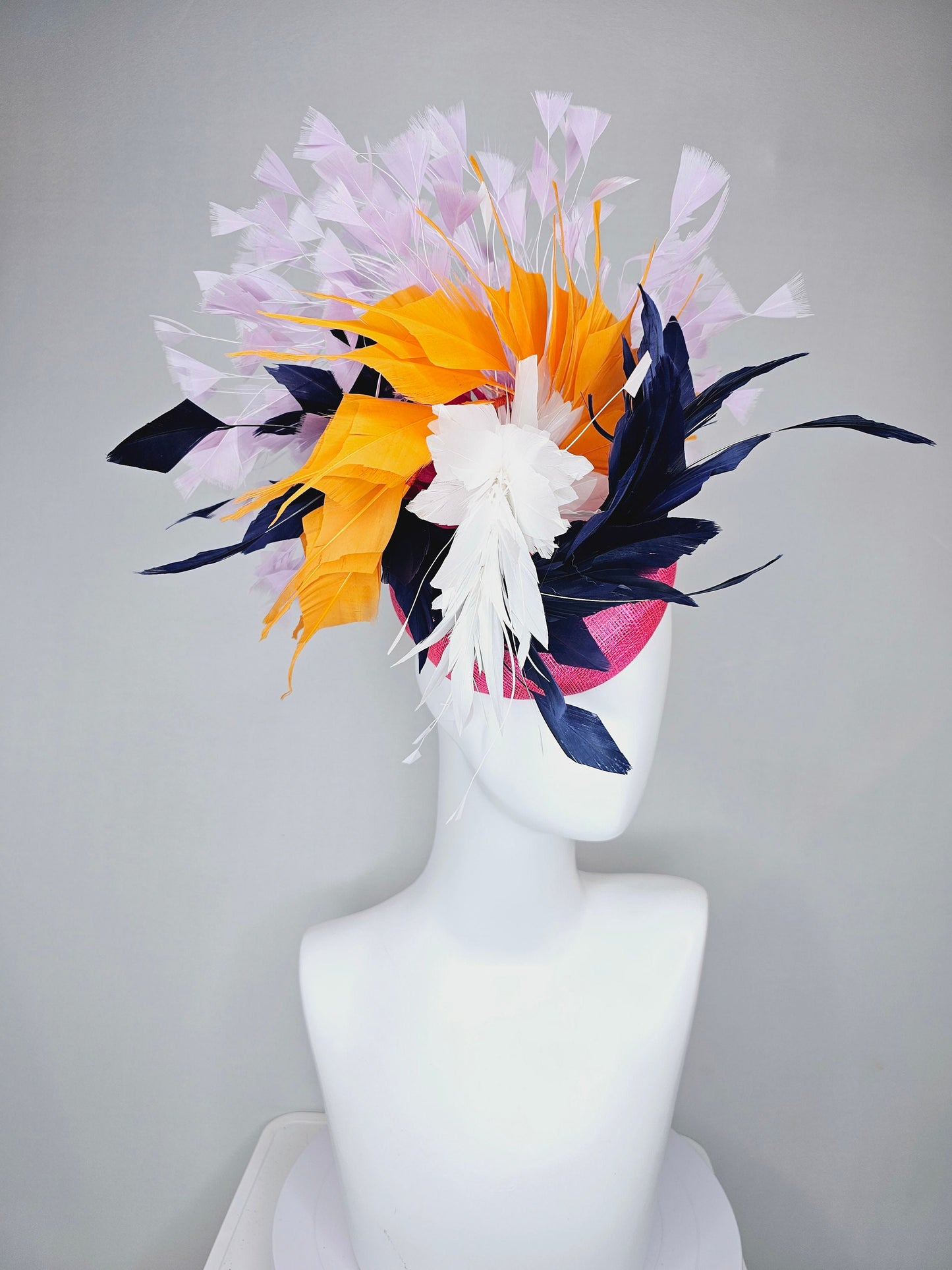 kentucky derby hat fascinator hot pink sinamay with navy blue, white ivory, apricot orange yellow, and lavender purple branching feathers