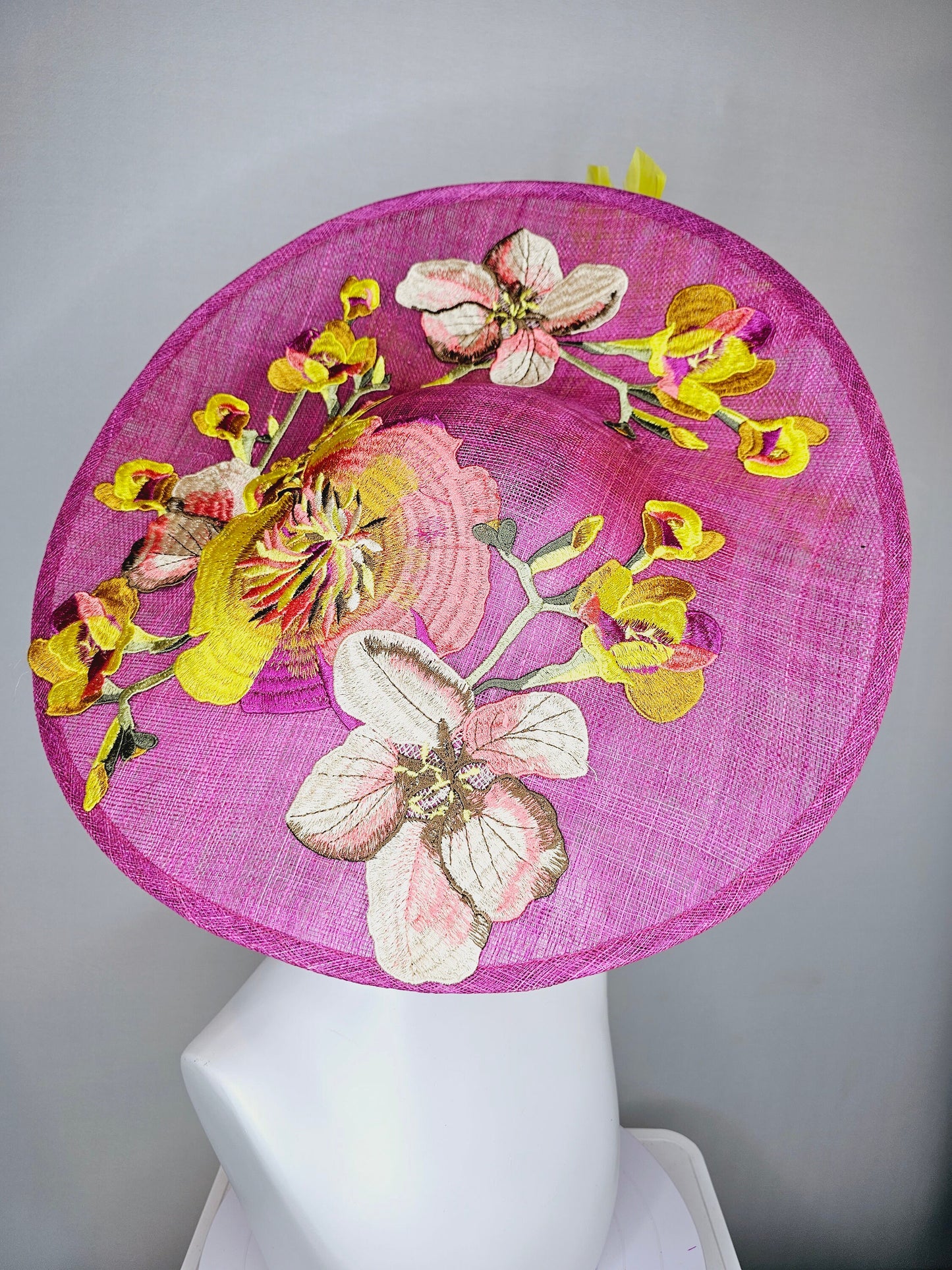 kentucky derby hat fascinator mulberry purple sinamay saucer with yellow coral purple pink embroidered flowers and peach yellow feathers